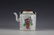 A Famille Rose Chinese Porcelain Teapot with Wooden