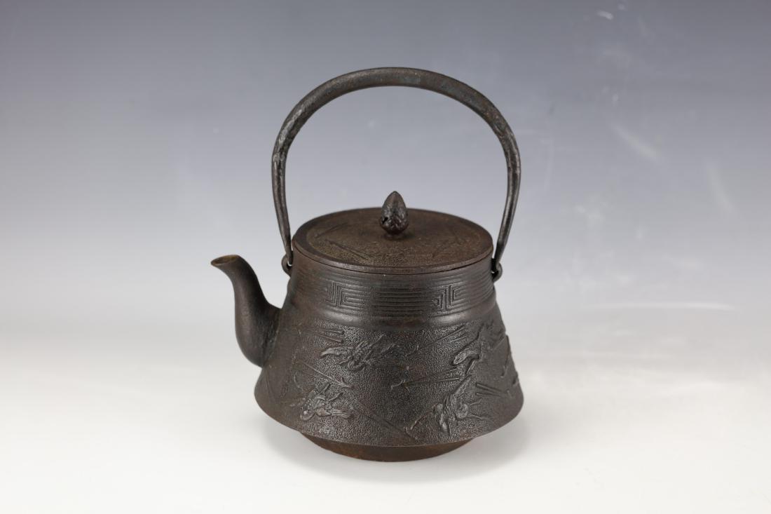 An Japanese Iron Tea Pot With Curved Birds: H: 10 inches/25.3 cm D: 7 inches/17.8 cm