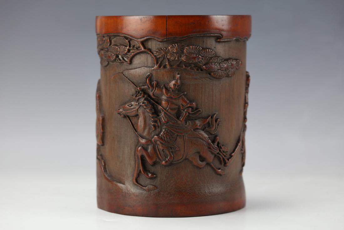 A Chinese Bamboo Figures Pen Brush Holder: H: 6 1/4 in. (15.8 cm.) W: 5 in. (12.7 cm.)