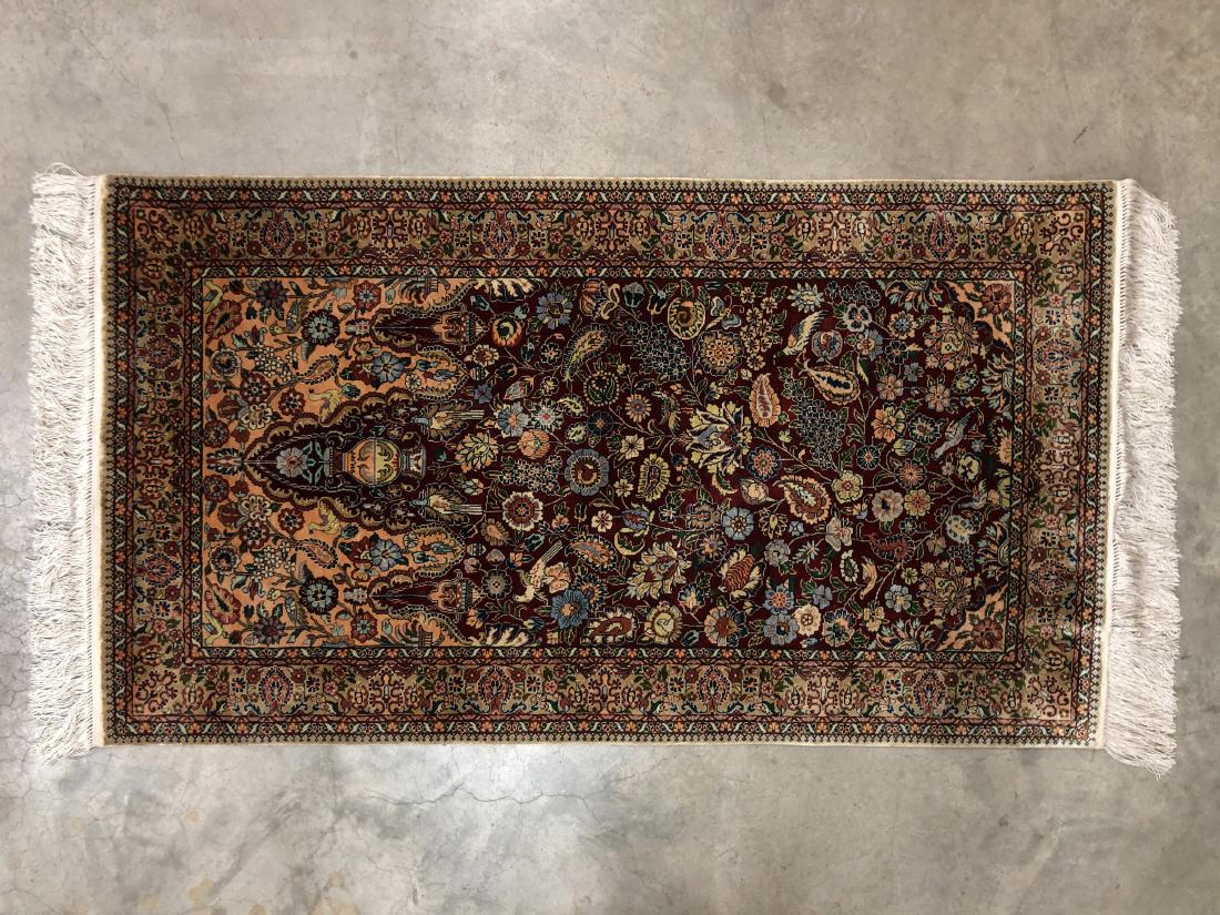 A Chinese Silk Hand Knotted Coffee Table Rug: 54 in. (137.16 cm.) x 27.75 in. (70.49 cm.)
