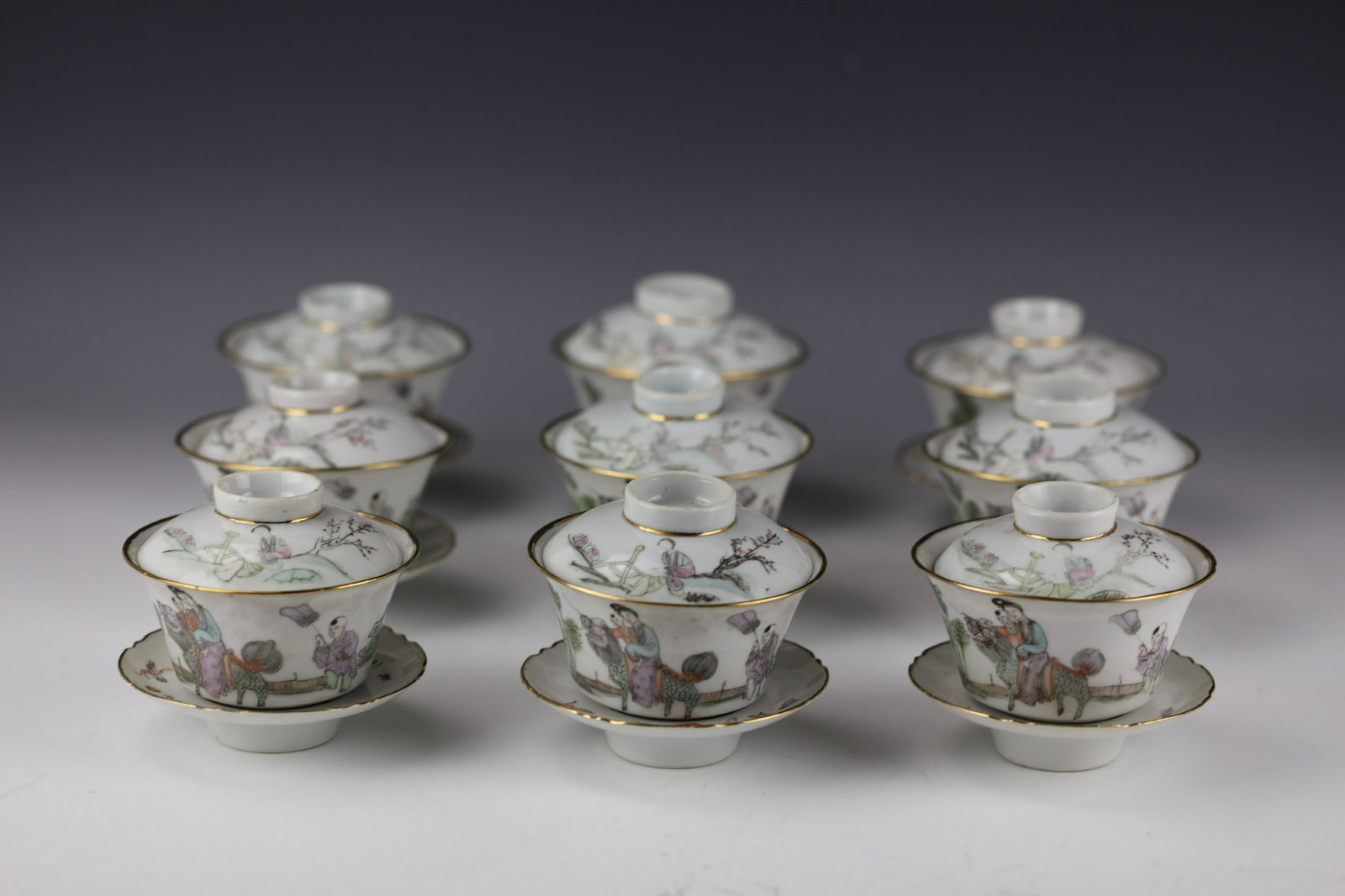 A Set of 9 Wan Zhulin Qianjiangcai Prcelain Teacup: H:4 in.(10 cm) x W:4 in. (10.5 cm) x9 Exhibited: Preview are available from November 18th to 22nd from 11:00AM TO 5:00PM Eastern Time Location: 15229 Display Court Rockville MD 20850.
