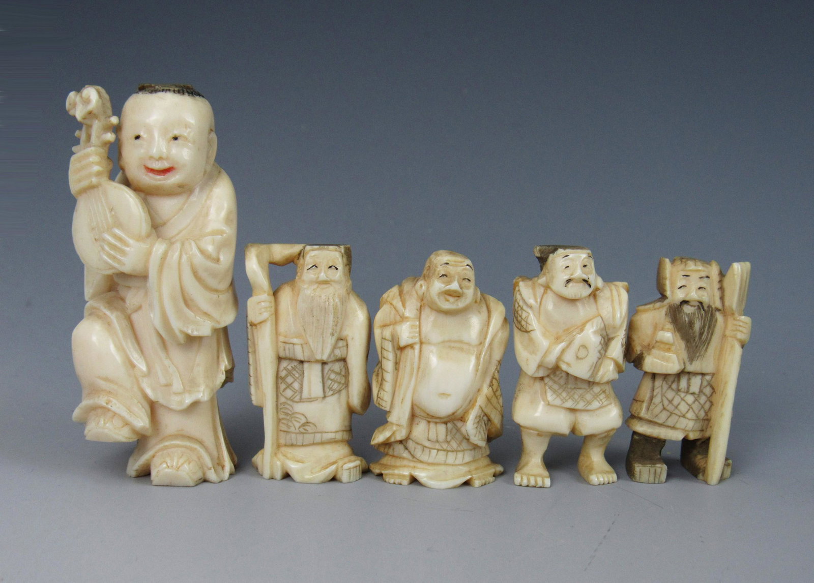 A Group of Netsuke Miniature Carved Bone Figurines: A Group of Netsuke Miniature Carved Bone Figurines. Tallest measures about 2.5 in. (6.4 cm)