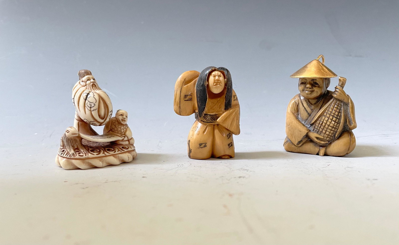 Group of 3 Japanese Signed Netsuke Miniature Sculpture: Group of 3 Japanese Signed Netsuke Miniature Sculpture Figurines. H: 1.5 in. (4.5 cm)