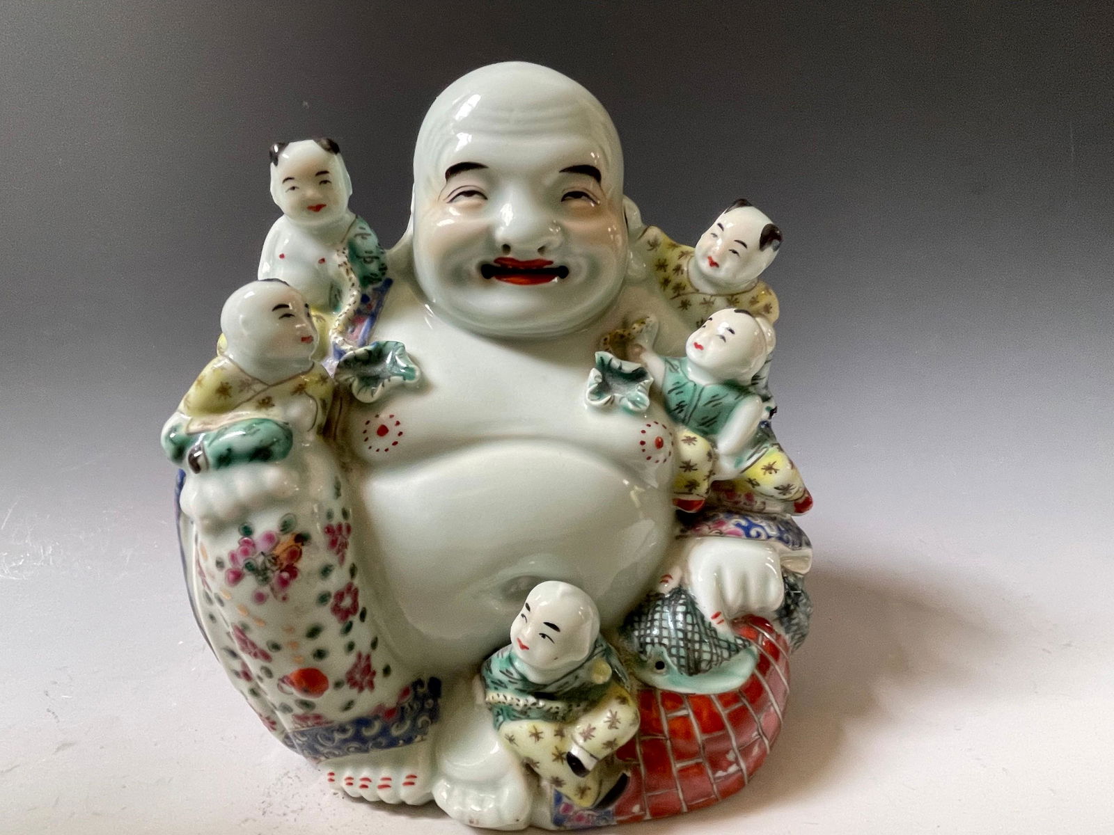 A Chinese Famille Rose Porcelain Happy Buddha Statue (1 of 5)