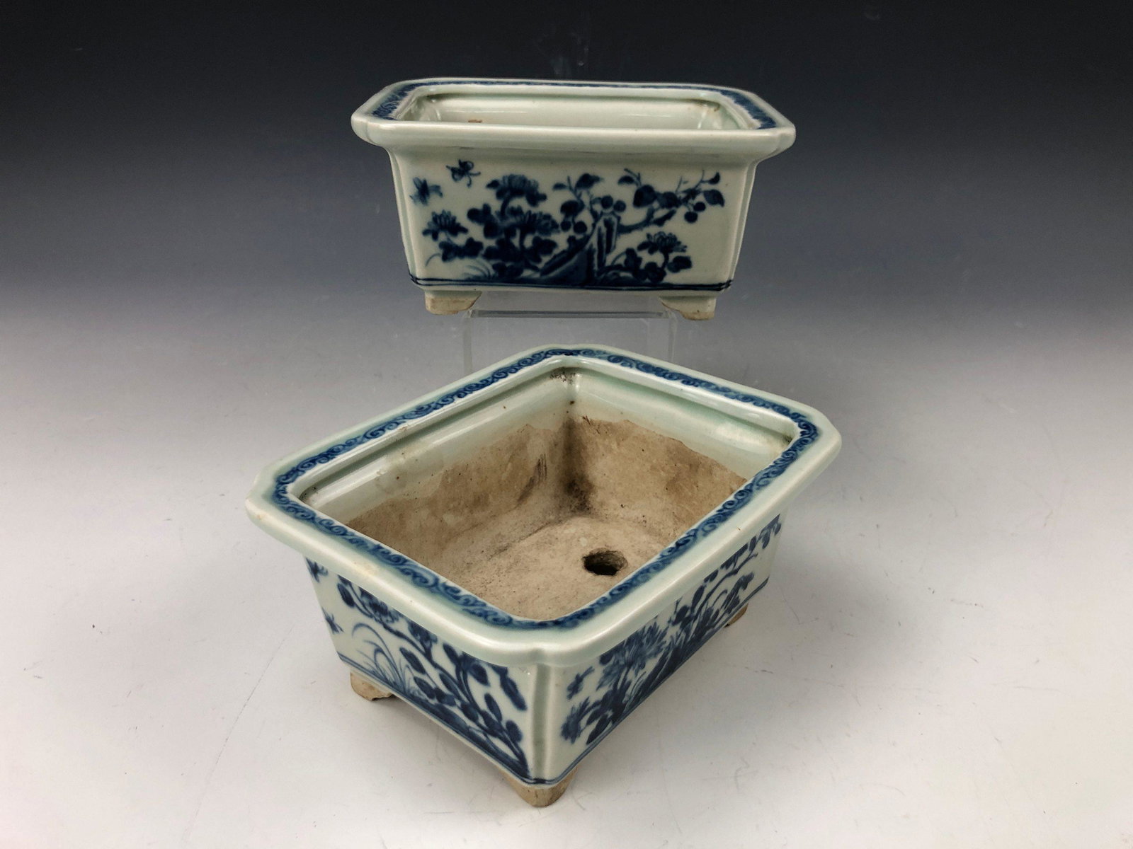 A Pair of Blue and White Flower Pots: A Pair of Blue and White Flower Pots H: 2.75 in. (9.99 cm) W: 5.75 in. (14.61 cm) D: 5 in. (12.7 cm)