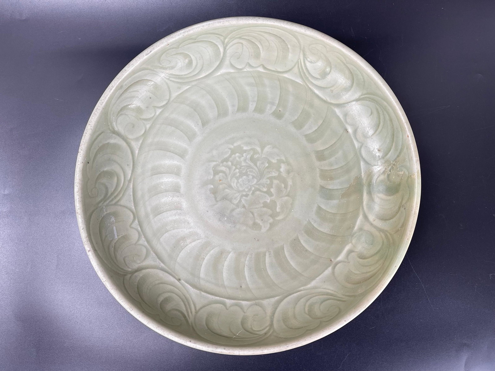A Chinese Longquan Celadon Charger: A Chinese Longquan Celadon Charger,D 13in.(33cm), PROVENANCE: Estate of Roberta Wright McCain, Washington, DC. preview from Mar 21st to 25th from 2:00 PM TO 6:00 PM Eastern Time, Location: 15229 Displ