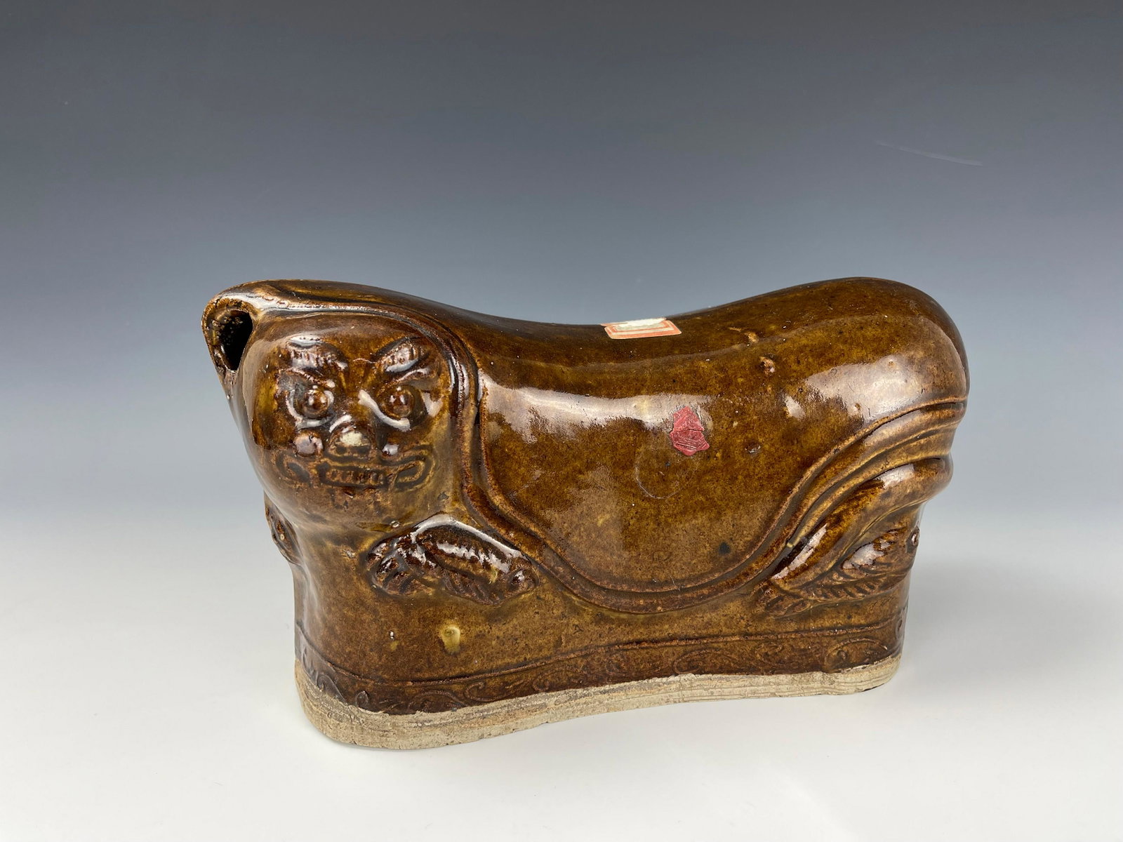A Chinese Tiger Shaped Ceramic Pillow: A Chinese Tiger Shaped Ceramic Pillow, Size 26 cm.( 10.8in.) x 14.5 cm.(5.7 in.) x 8 cm.(3 in.),preview from Jun 6th to 10th from 2:00 PM TO 6:00 PM Eastern Time, Location: 15229 Display Court Rockvil