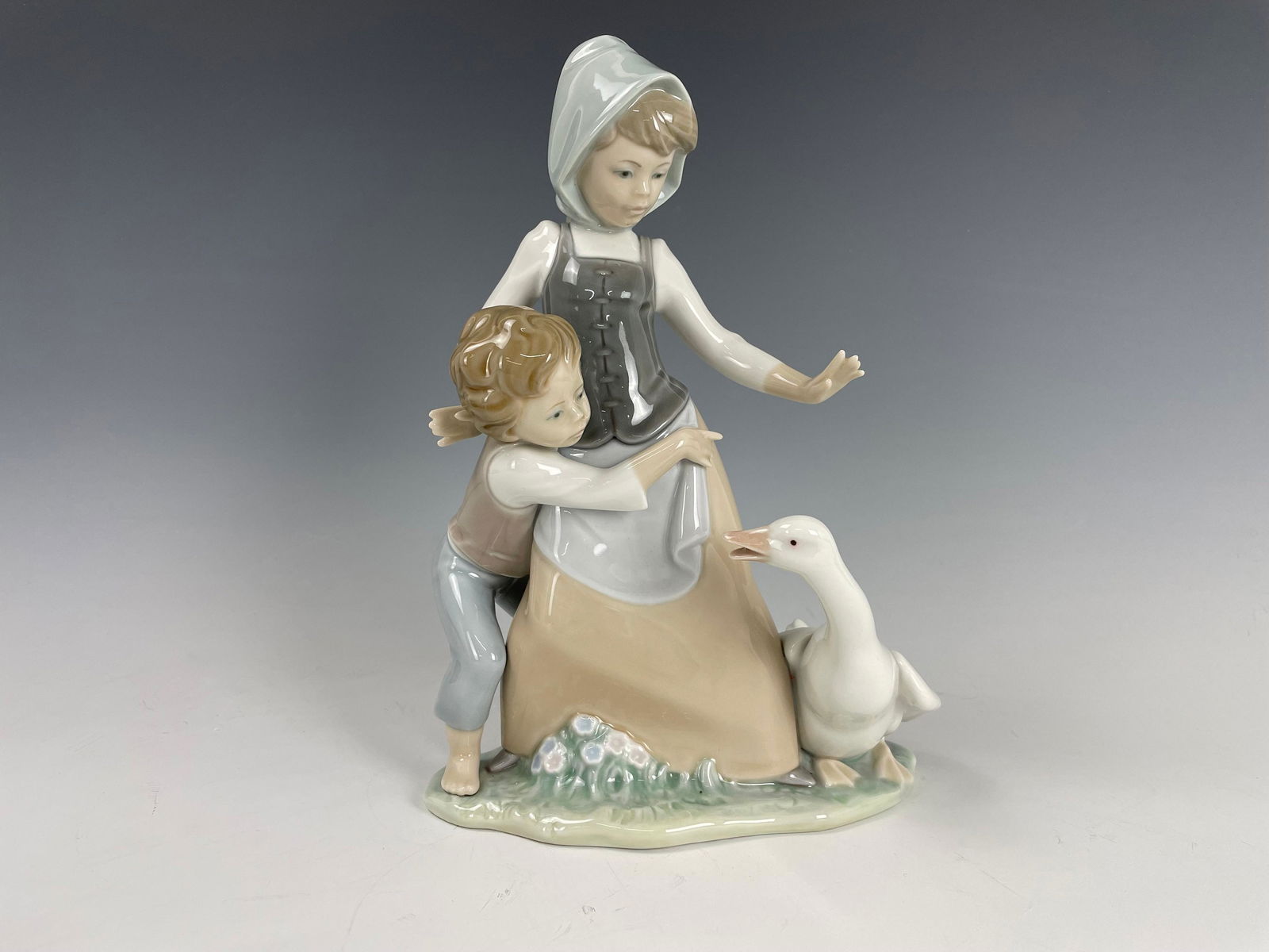 A Lladro Children and Duck figurine (1 of 5)