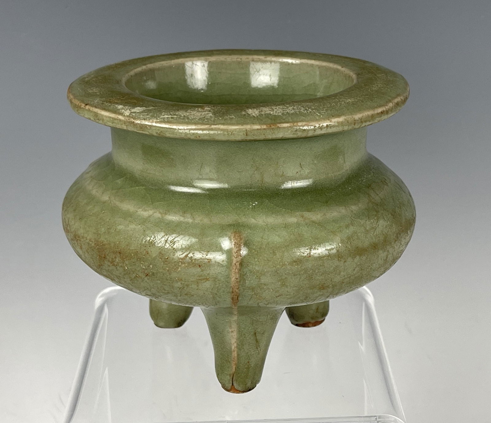 A Chinese Longquan Celadon Porcelain Tripod Censer: A Chinese Long Quan Celadon Porcelain Tripod Censer, H 9 cm. (3.5 in.) x D 10 cm. (4 in.), Preview from Aug. 22nd to 26th from 2:00 PM TO 6:00 PM Eastern Time, Location: 15229 Display Court, Rockville