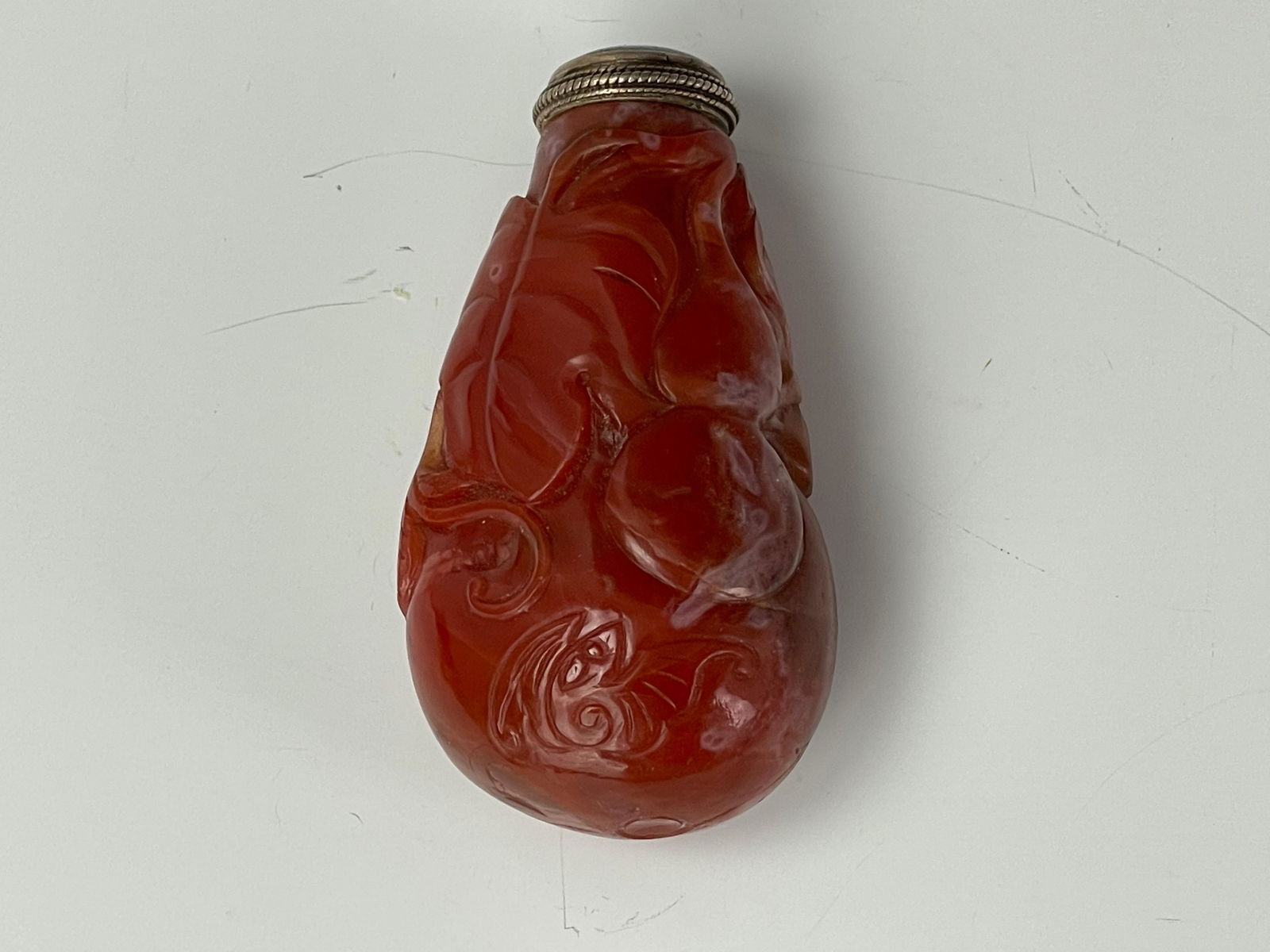 A Chinese Carved Red Agate Snuff Bottle (1 of 4)