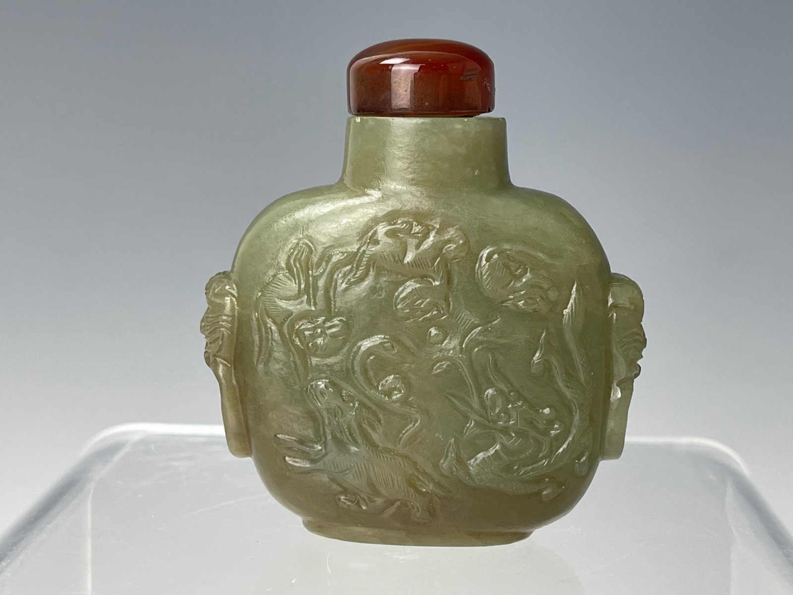 A Chinese Jade Carved Snuff Bottle: A Chinese Jade Carved Snuff Bottle, H 6 cm(2.5 in.), Preview from Aug. 22nd to 26th from 2:00 PM TO 6:00 PM Eastern Time, Location: 15229 Display Court, Rockville MD 20850.