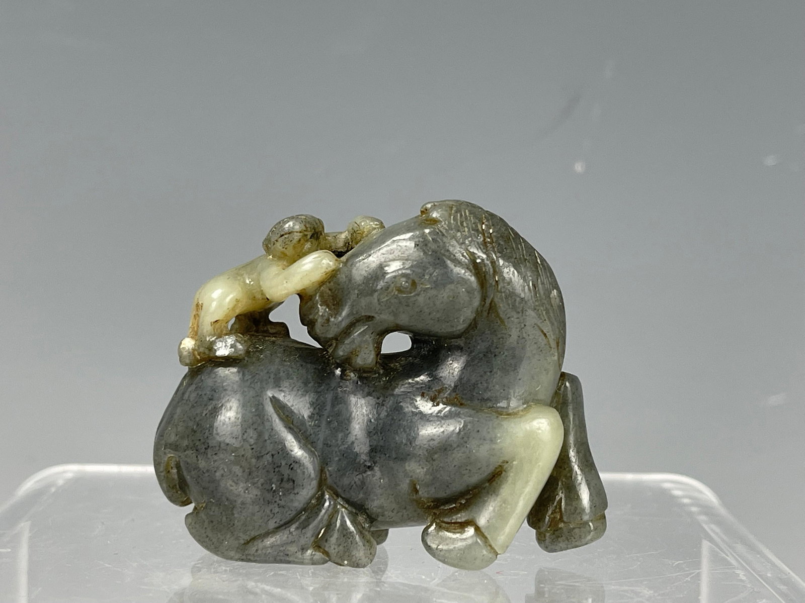 A Chinese Carved Jade Horse and Monkey: A Chinese Carved Jade Horse and Monkey, W 5 cmx H 4 cm x D 2 cm,Preview from Apr. 17th to 21st from 1:00 PM TO 5:00 PM Eastern Time, Location: 15229 Display Court, Rockville MD 20850.