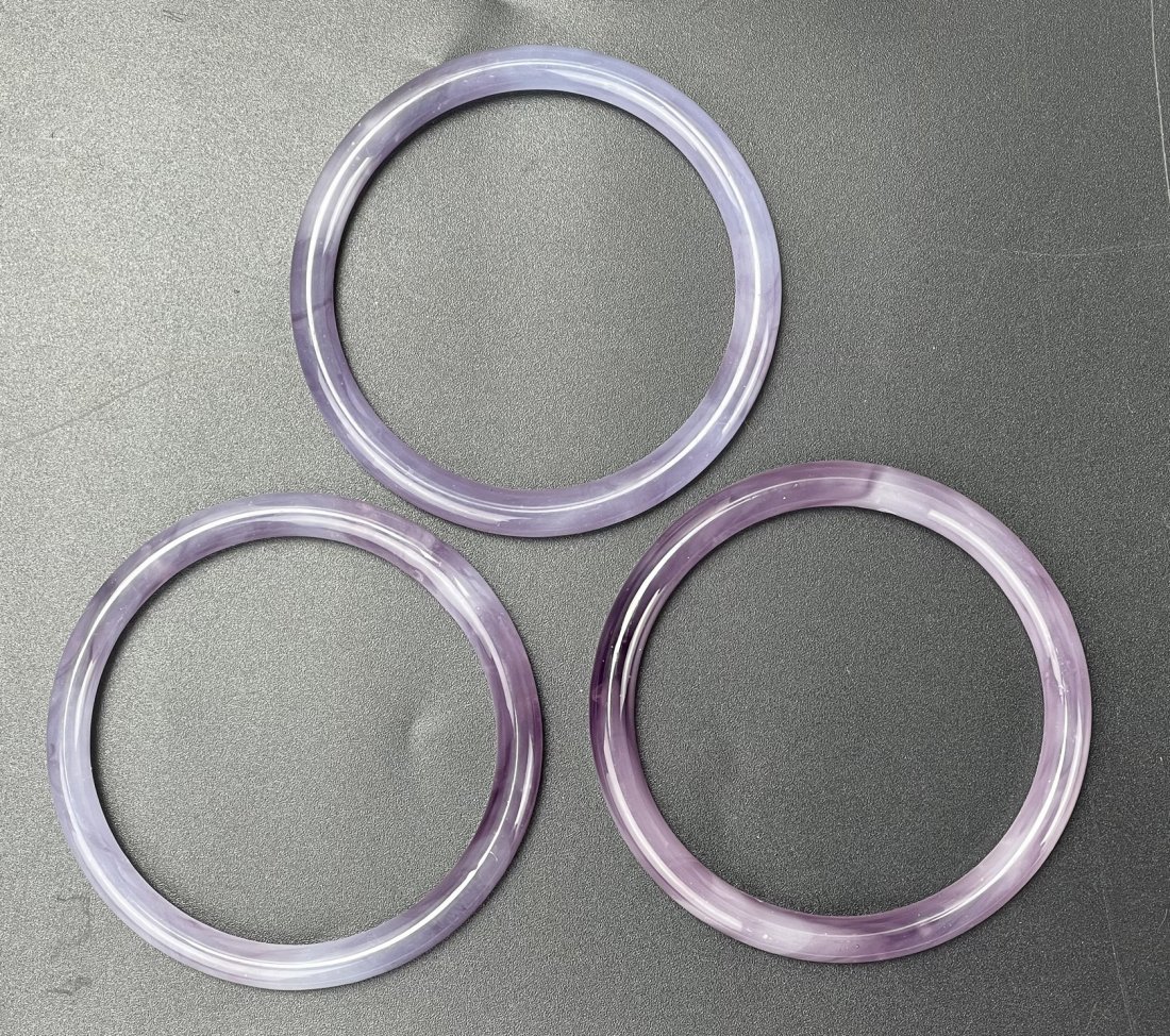 Three Purple Chalcedony Round Bracelets: Three Purple Chalcedony Round Bracelets, D 7.5 cm (3 in.) x3, Preview from Apr. 17th to 21st from 1:00 PM TO 5:00 PM Eastern Time, Location: 15229 Display Court, Rockville MD 20850.