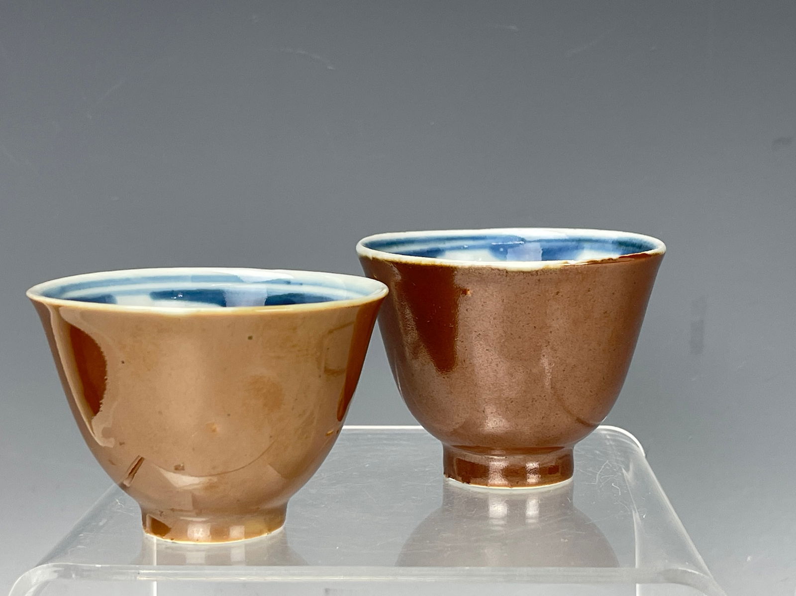 Two Antique Blue and White Porcelain Cups Brown Glazed: Two Antique Blue and White Porcelain Cups Brown Glazed, H 5 m( 2 in.) x D 7 cm(2.8 in.) x2,Preview from Oct. 2nd to 6th from 1:00 PM TO 5:00 PM Eastern Time, Location: 15229 Display Court, Rockville M