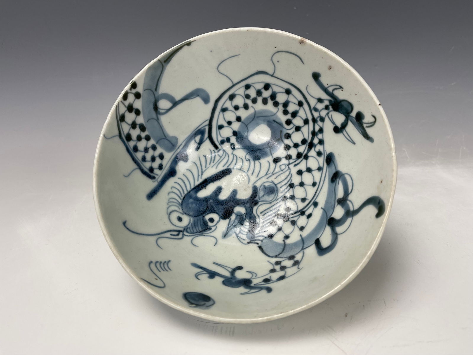 Chinese Antique Blue and White Porcelain Dragon Bowl: A Chinese Antique Blue and White Porcelain Dragon Bowl, D 16.5cm(6.5 in.) x H 7.8 cm(3.7 in.),Preview from Oct. 2nd to 6th from 1:00 PM TO 5:00 PM Eastern Time, Location: 15229 Display Court, Rockvill