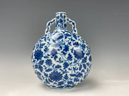 A Chinese Blue and White Porcelain Flat Flask Vase Marked: A Chinese Blue and White Porcelain Flat Flask Vase with scrolling flowers with double loop ears,qianlong mark, H 18 cm(7 in.), Preview from Dec. 11th to 15th from 1:00 PM TO 5:00 PM Eastern Time, Loca