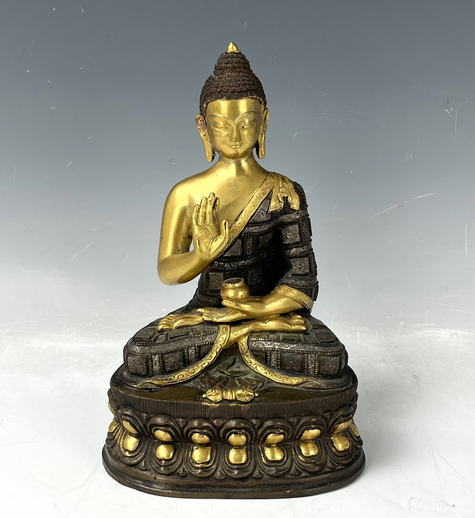 A Chinese Bronze Buddha Statue: A Chinese Bronze Buddha Statue, H 20.5 cm( 8in.), Preview from Dec. 11th to 15th from 1:00 PM TO 5:00 PM Eastern Time, Location: 15229 Display Court, Rockville MD 20850.