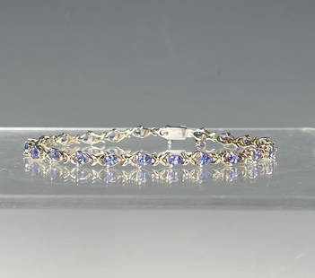 A Sterling Silver Tanzanite Tennis Bracelet: A Sterling Silver Tanzanite Tennis Bracelet,L 17 cm(6.8 in.), Preview from Dec. 11th to 15th from 1:00 PM TO 5:00 PM Eastern Time, Location: 15229 Display Court, Rockville MD 20850.