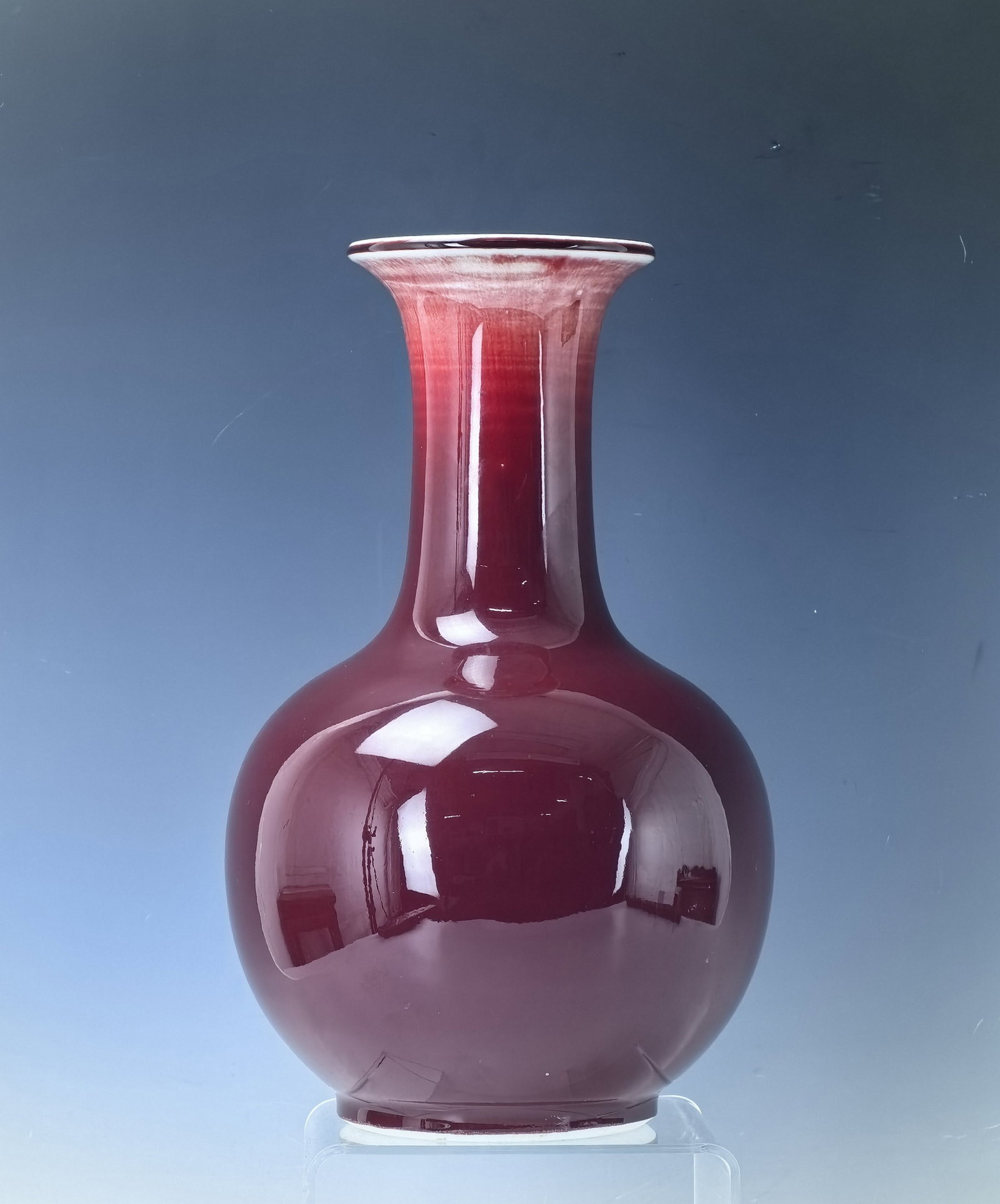 A Chinese Red Glazed porcelain Vase 20TH Century: A Chinese Red Glazed porcelain Vase 20TH Century,Jingdechen Mark, H 29 cm(11.5 in.), Preview from Apr. 22nd to 26th from 1:00 PM TO 5:00 PM Eastern Time, Location: 15229 Display Court, Rockville MD 20