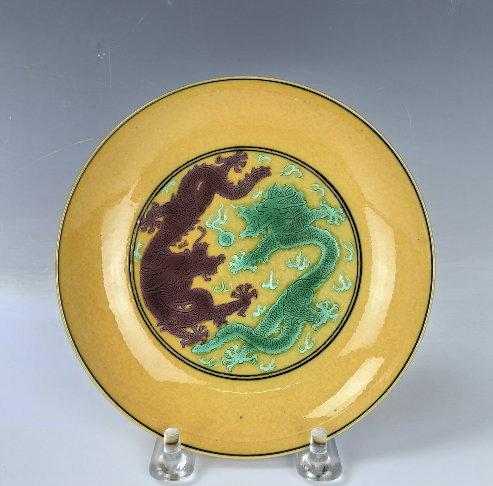 Small Plate with Green and Purple Dragons on Yellow Ground: Small Plate with Green and Purple Dragons on Yellow Ground, Kangxi Mark, D 13.6 cm(5.7 in.),Preview from Apr. 22nd to 26th from 1:00 PM TO 5:00 PM Eastern Time, Location: 15229 Display Court, Rockvill