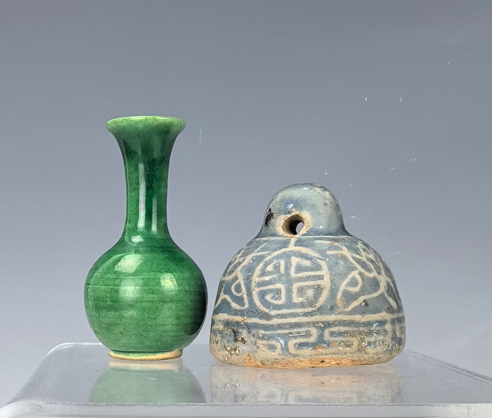 Chinese Porcelain Weight and Small Green Vase: Chinese Porcelain Weight and Small Green Vase, Vase H 6.3 cm(2.5 in.) and Weight H 5 cm(2 in.), Preview from Apr. 22nd to 26th from 1:00 PM TO 5:00 PM Eastern Time, Location: 15229 Display Court, Rock