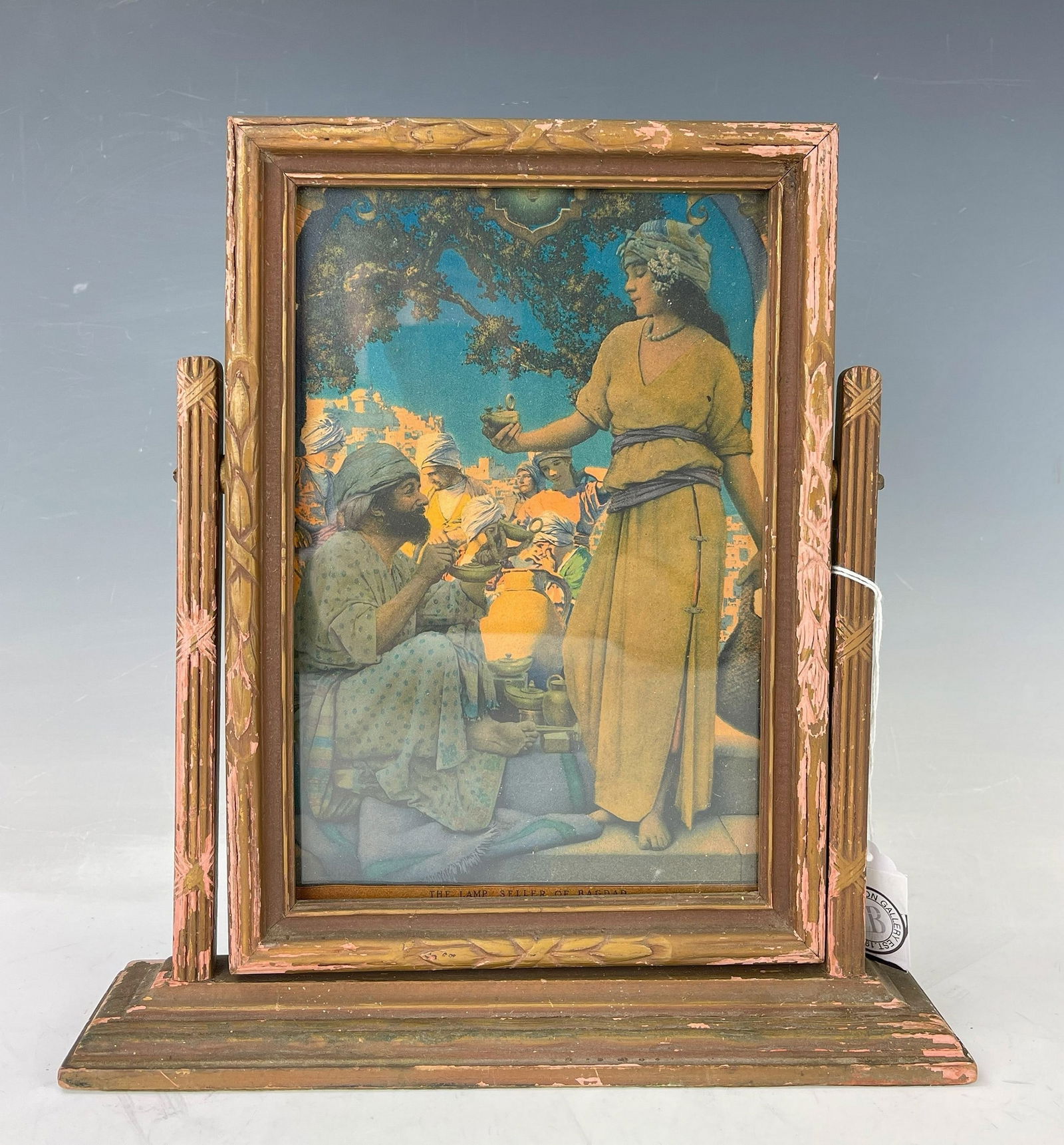 A Painting about The Lamp Seller of Bagdad with Wood Stand: Original Maxfield Parrish the Lamp Seller of Baghdad Print in Original Carved Wood Frame stand, W 21 cm (8 in.) x H 28 cm (11 in.), Preview from May 27th to 31st from 1:00 PM TO 5:00 PM Eastern Time,
