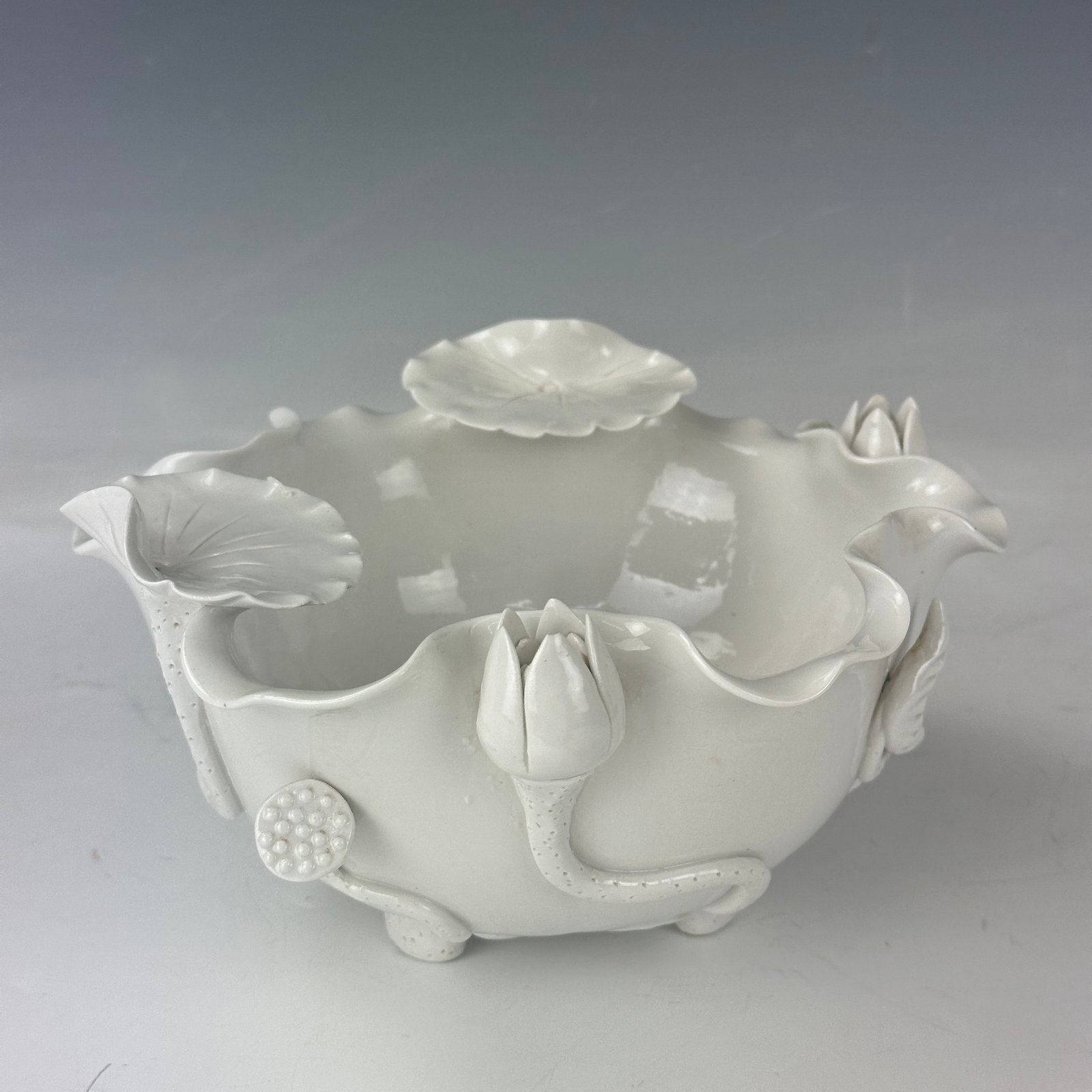 Lovely Hand Crafted Pottery Bowl: Lovely Hand Crafted Pottery Bowl Decorated with sculpted lotus, W 20 cm (8 in.) x H 10 cm (4 in.), Preview from May 27th to 31st from 1:00 PM TO 5:00 PM Eastern Time, Location: 15229 Display Court, Ro
