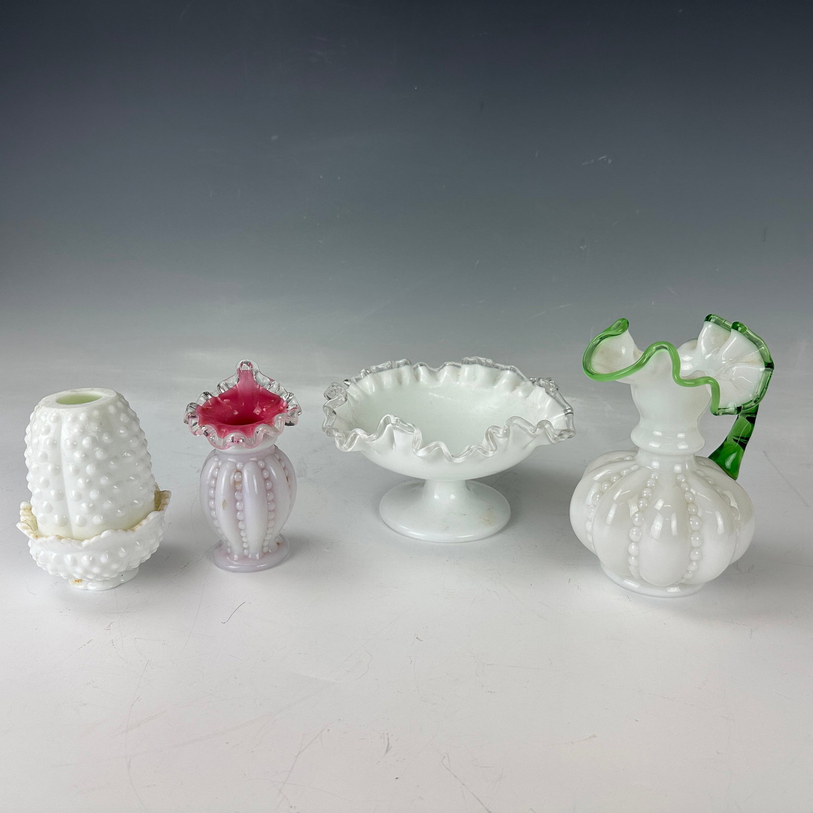 Group of Four Fenton Glass: Group of Four Fenton Glass, the biggest one H 16 cm ( 6.3 in.), Preview from May 27th to 31st from 1:00 PM TO 5:00 PM Eastern Time, Location: 15229 Display Court, Rockville MD 20850.