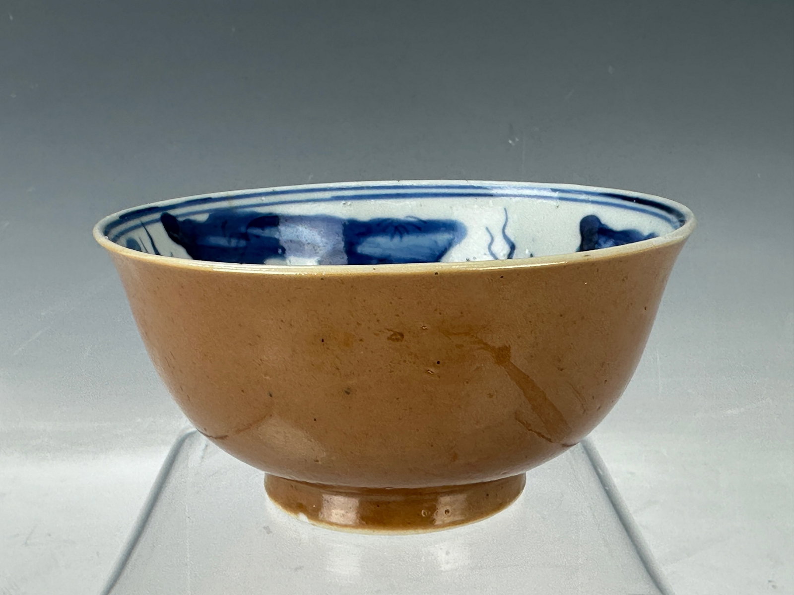 Chinese Brown Porcelain Bowl Painted with Blue and White Fish Wanyu Mark: Chinese Brown Glazed Porcelain Bowl Painted with Blue and White Fish on Interior, Wan Yu mark, Diam12cm. Preview from Jun. 24th to 28th from 1:00 PM TO 5:00 PM Eastern Time, Location: 15229 Display Co