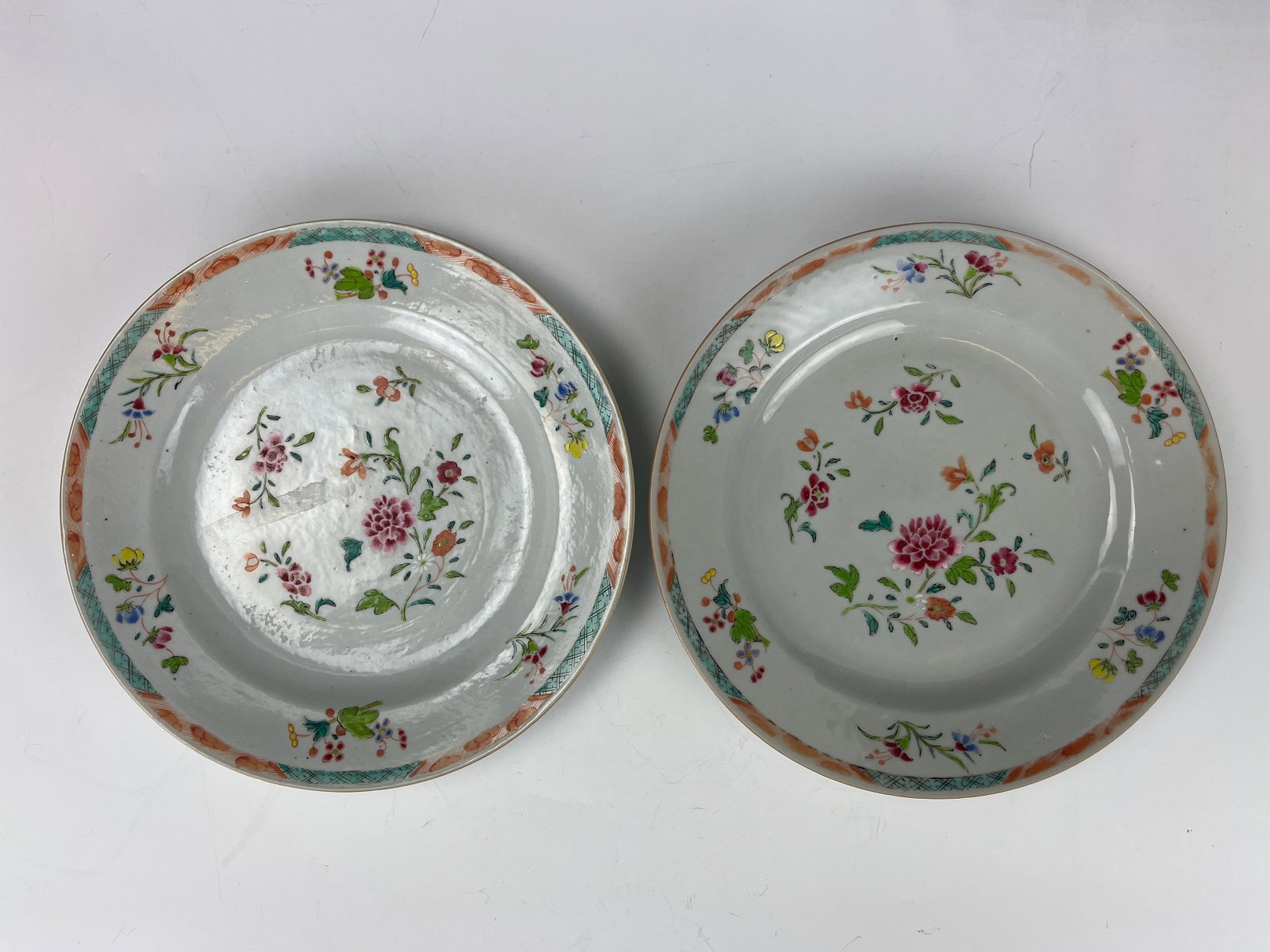 A Pair of Chinese Famille Rose Porcelain Plates with Flowers: A Pair of Chinese Famille Rose Porcelain Plates with Flowers,D 22.9 cm (9 in.) x 2. Preview from June 24th to 28th from 1:00 PM TO 5:00 PM Eastern Time, Location: 15229 Display Court, Rockville MD 208