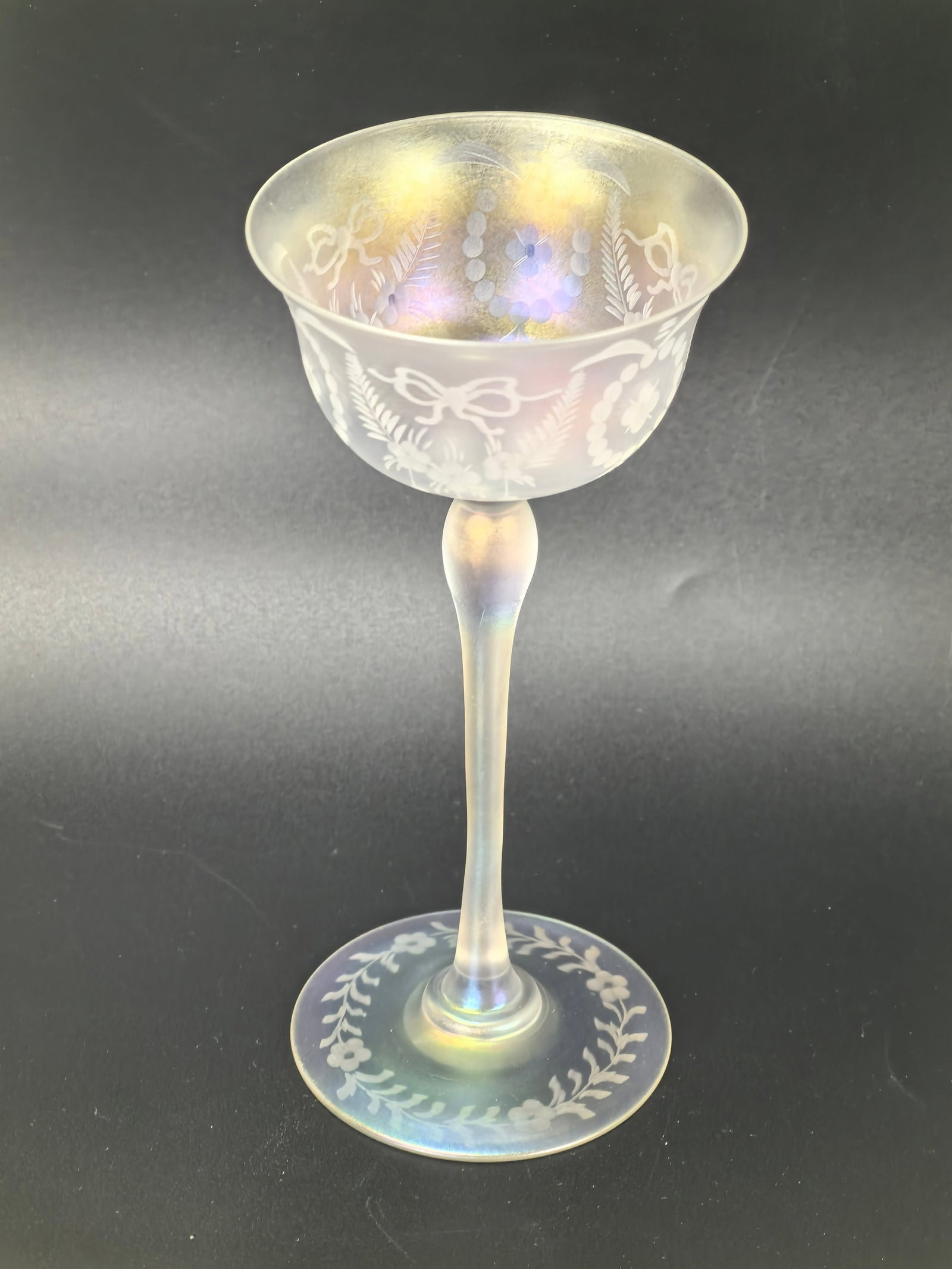 A Steuben Iridescent Wine Glasses: A Steuben Iridescent Wine Glasses,H 17 cm(6.8 in.), Preview from Jun. 24th to 28th from 1:00 PM TO 5:00 PM Eastern Time, Location: 15229 Display Court, Rockville MD 20850.