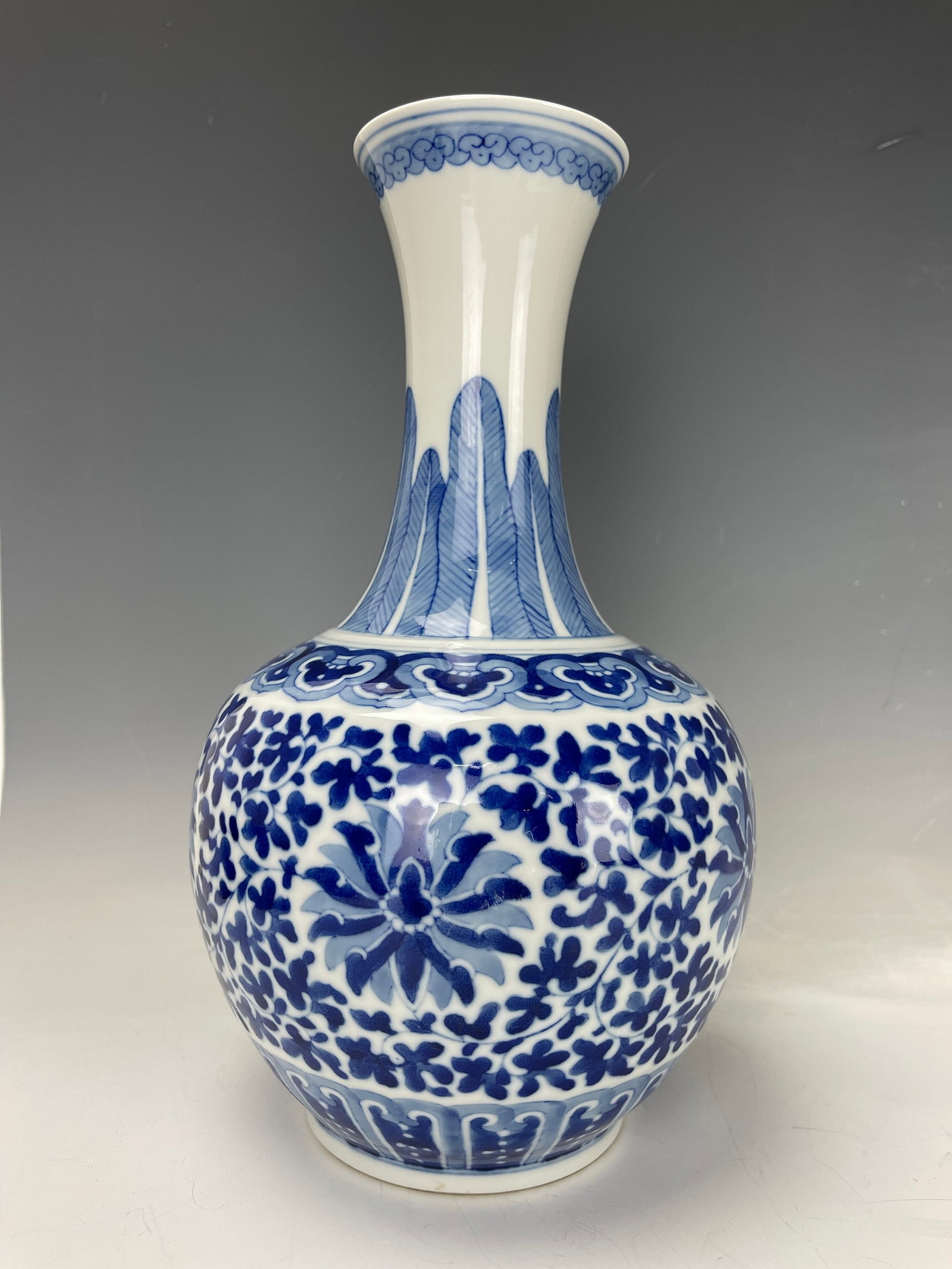 Chinese Blue and White Porcelain Vase with Scrolling Flowers: Chinese Blue & white vase with scrolling flowers. Wanli mark, but 20th century.H 29 cm(11.5 in.). Preview from Aug. 26th to 30th from 1:00 PM TO 5:00 PM Eastern Time, Location: 15229 Display Court, Ro