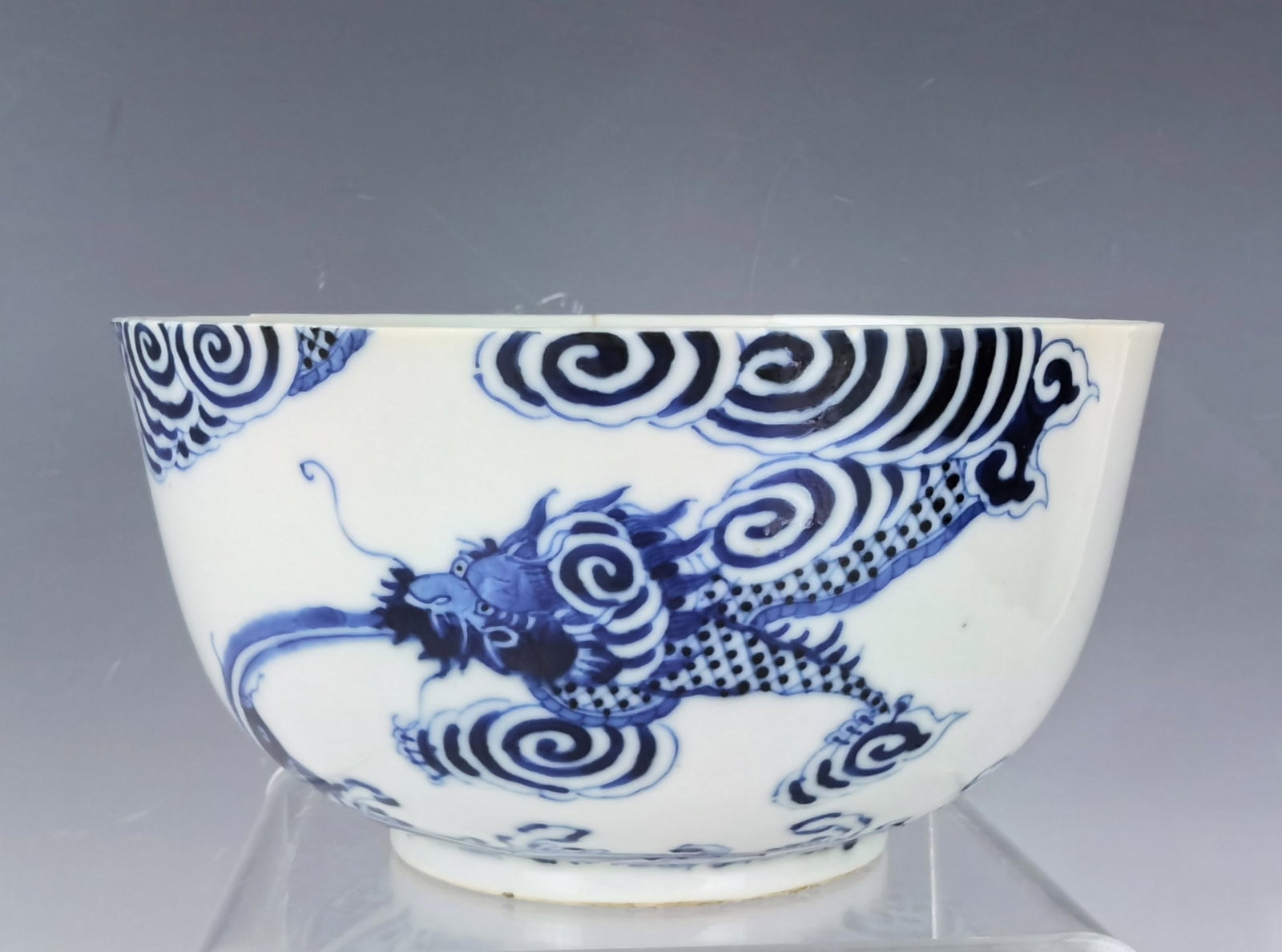 Blue and White Deep Porcelain Bowl Painted with Dragons Marked: Blue and White Deep Bowl Painted with Dragons. Neifu mark.repaired, D 16.5 cm(6.5 in.) x H 7.5 cm(3 in.). Preview from Aug. 26th to 30th from 1:00 PM TO 5:00 PM Eastern Time, Location: 15229 Display C