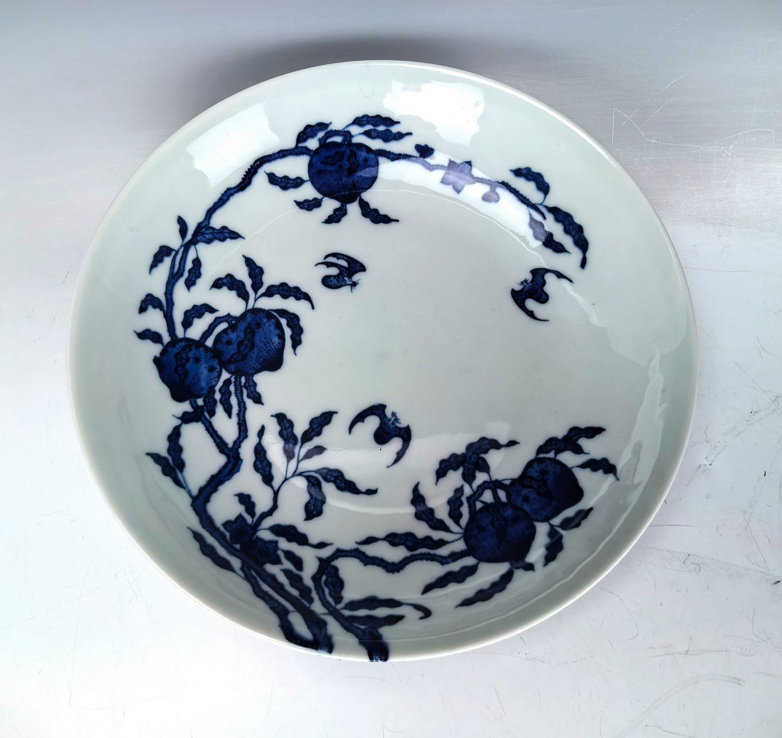 Chinese Porcelain Blue and White Charger Yongzheng Mark: Chinese Porcelain Blue and White Charger Painted with bats and peaches. Yongzheng mark. D 22 cm(8.7 in.). Preview from Aug. 26th to 30th from 1:00 PM TO 5:00 PM Eastern Time, Location: 15229 Display C