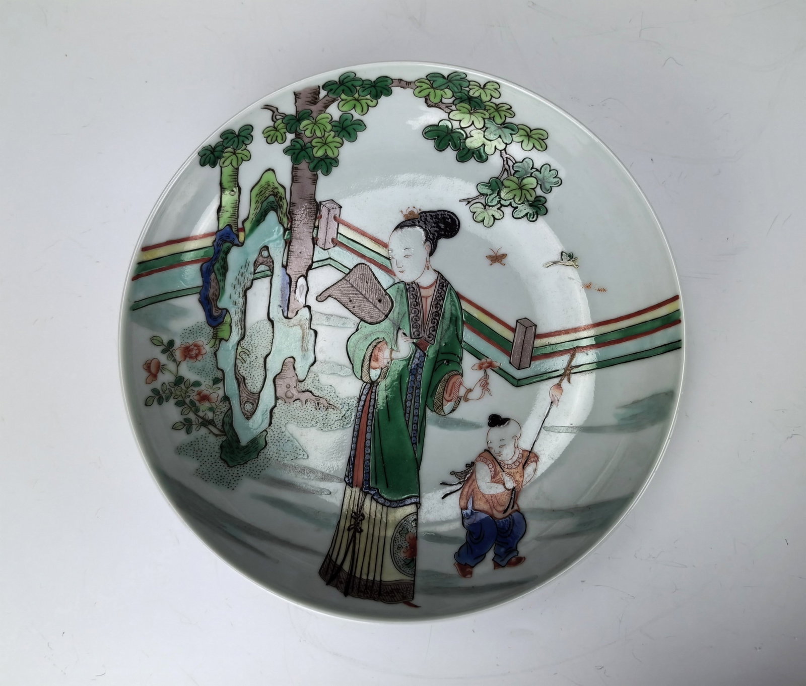 Chinese Famille Verte Porcelain Plate Kangxi Mark: A Famille Verte Plate Painted with Beauties with Children. Kangxi mark, D 18 cm(7 in.). Preview from Aug. 26th to 30th from 1:00 PM TO 5:00 PM Eastern Time, Location: 15229 Display Court, Rockville MD