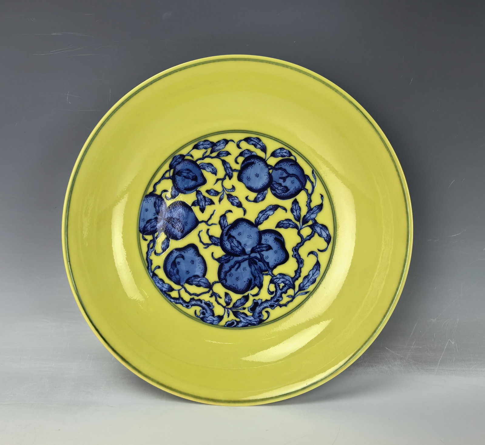 Chinese Blue and White on Yellow Ground Porcelain Plate Yongzheng Mark: A Chinese Plate painted with blue & white flowers on imperial yellow ground, Yongzheng Mark,D 22 cm(8.7 in.). Preview from Aug. 26th to 30th from 1:00 PM TO 5:00 PM Eastern Time, Location: 15229 Displ