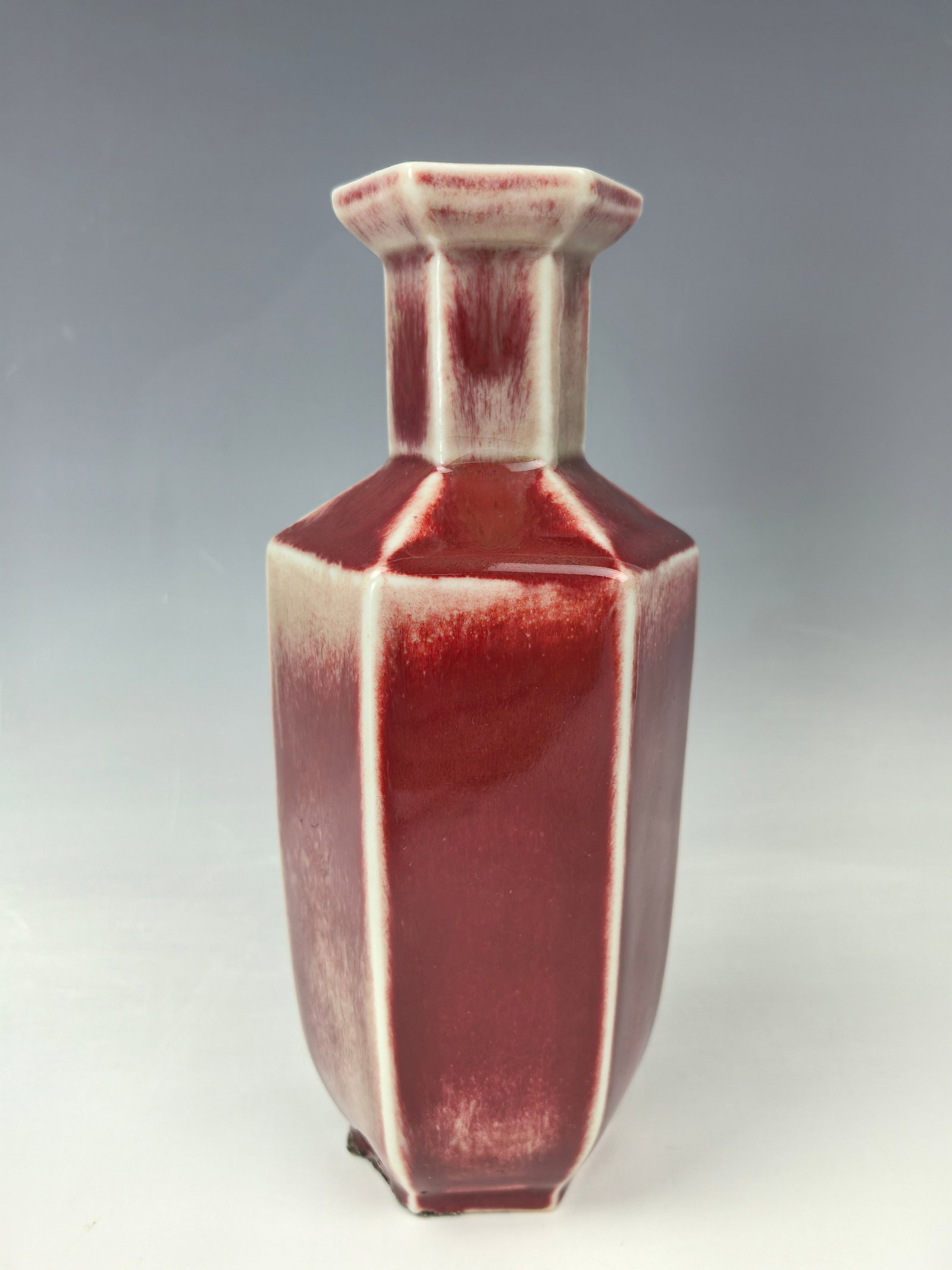 A Chinese Red Glazed Octagonal Vase: Chinese Red Glazed octagonal vase,H 19 cm (7.48in.), Preview from Oct. 14th to 18th from 1:00 PM TO 5:00 PM Eastern Time, Location: 15229 Display Court, Rockville MD 20850.