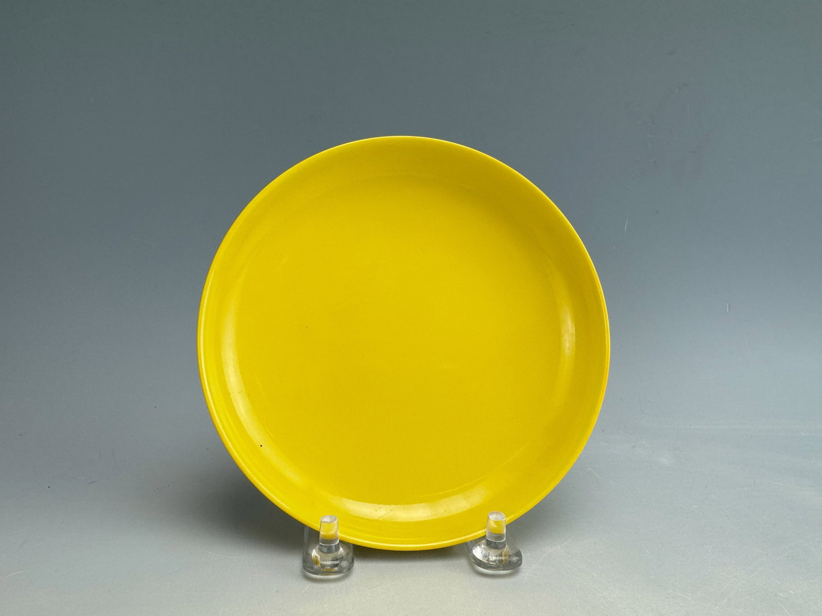 Chinese Imperial Yellow GlazedPplate Yongzheng Mark: Imperial Yellow glazed plate. Yongzheng in double square ring. D 23 cm(9 in.).Preview from Feb.17th to 21st from 1:00 PM TO 5:00 PM Eastern Time, Location: 15229 Display Court, Rockville MD 20850.