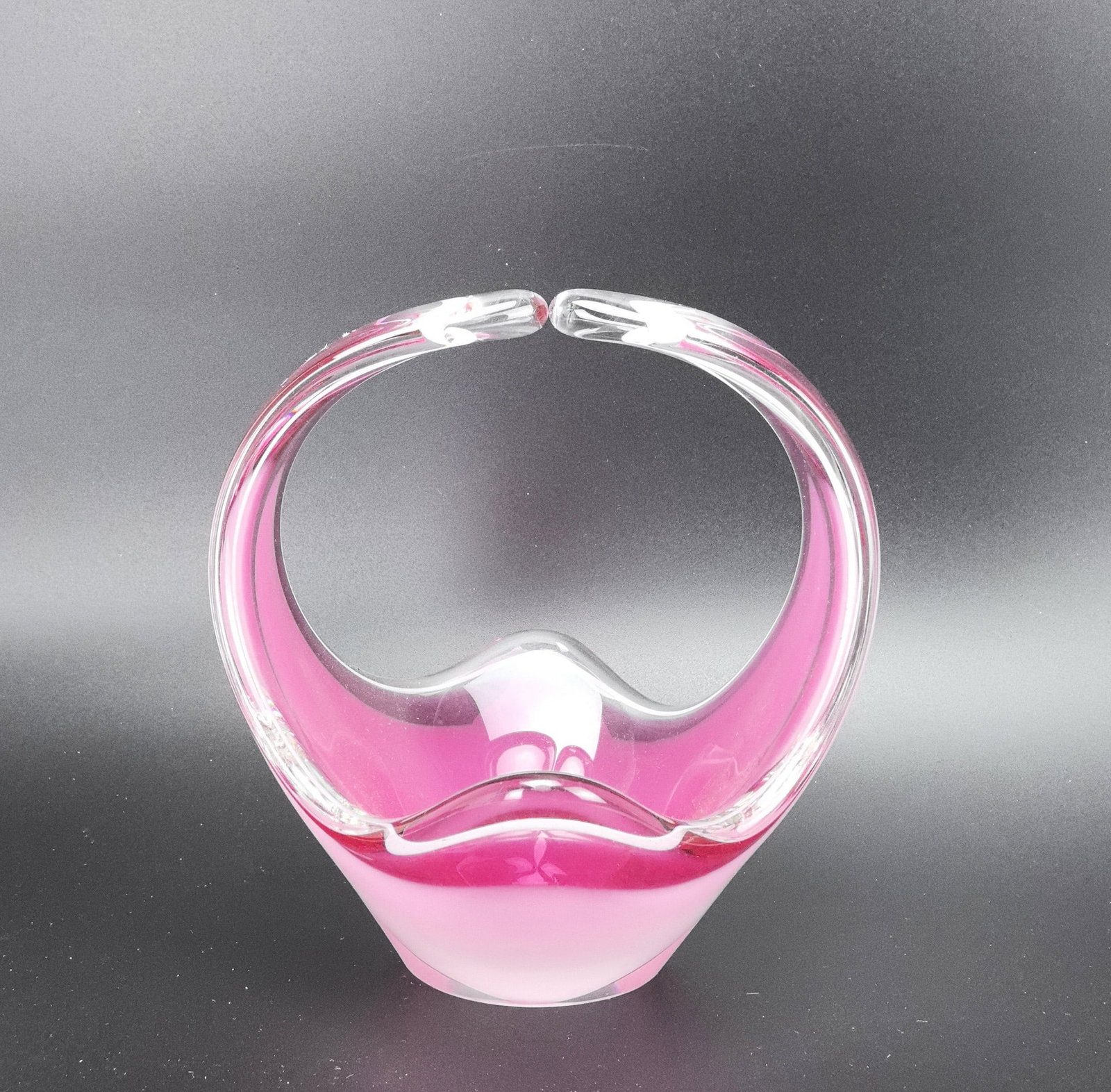 Pink Art Glass Basket Coquille Swedish Signed: Pink Art Glass Basket Coquille Swedish Signed.H 21 cm(8.2 in.) .Preview from Feb.17th to 21st from 1:00 PM TO 5:00 PM Eastern Time, Location: 15229 Display Court, Rockville MD 20850.