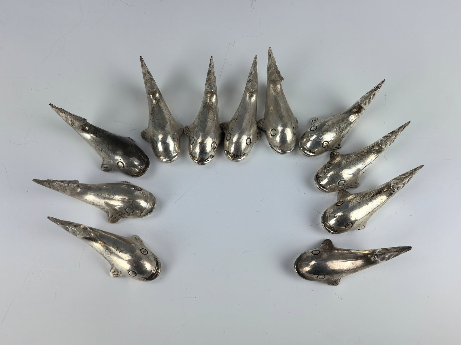 Group of 11 Silver Plated Whale Chopstick Rests: Group of 11 Silver Plated Whale Chopstick Rests, Size 5.2x2.5x2.3 cm x11. Preview from Apr. 21st to 25th from 1:00 PM TO 5:00 PM Eastern Time, Location: 15229 Display Court, Rockville MD 20850.