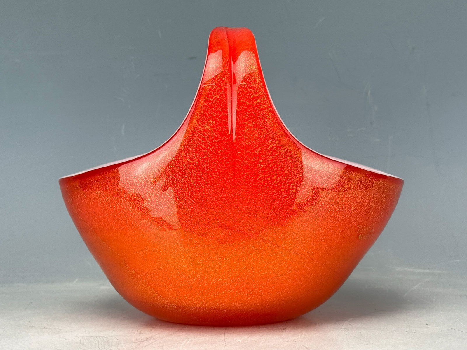 Alfredo Barbini Orange with Gold Flack Basket type Art Glass Vase: Alfredo Barbini Orange with Gold Flack Basket type Art Glass Vase. H 15 cm(6 in.) x W 15 cm(6 in.).Preview from Apr. 21st to 25th from 1:00 PM TO 5:00 PM Eastern Time, Location: 15229 Display Court, R