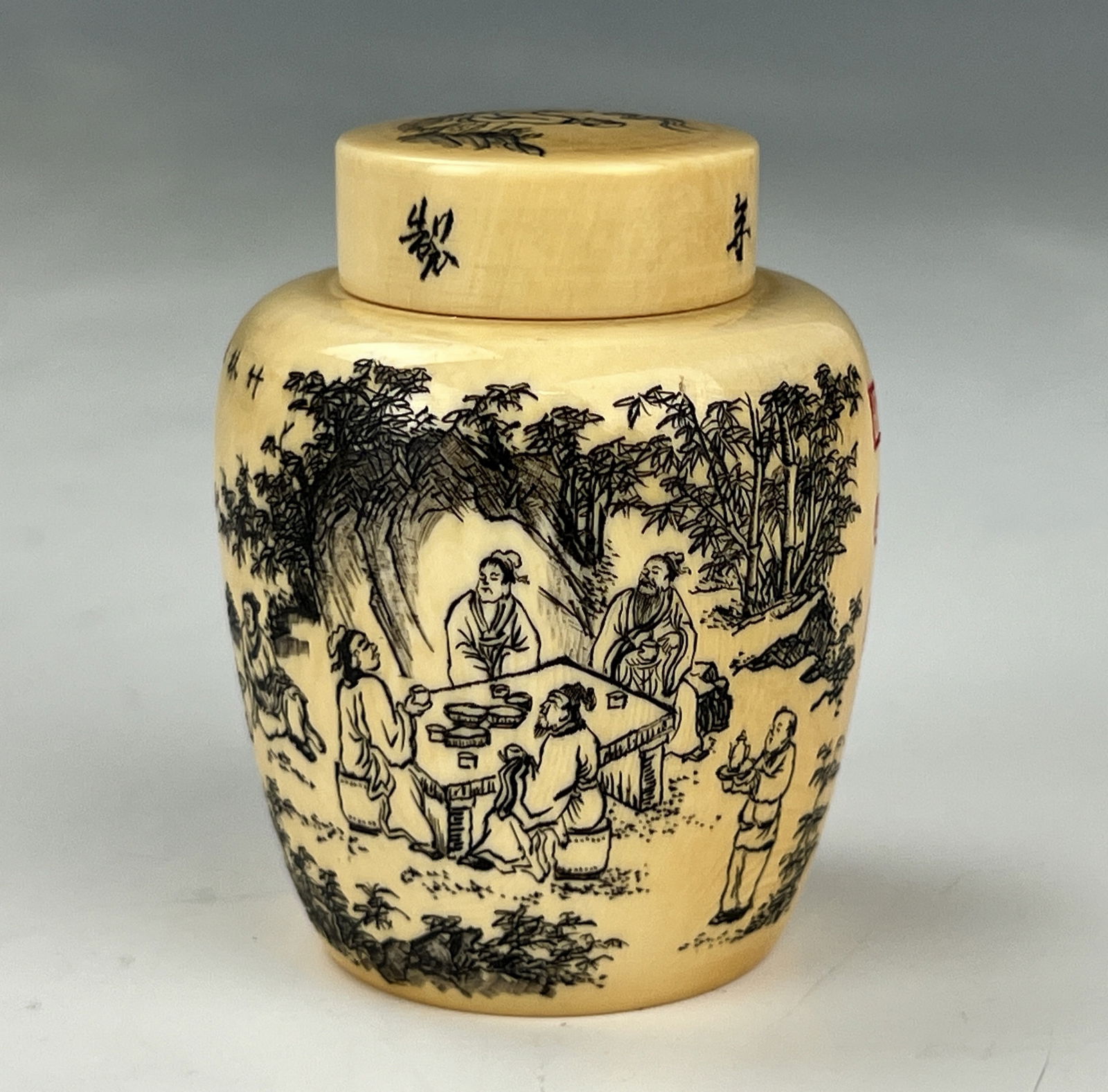 A Chinese Carved Bone Vase with Figurines and Script Lidded: A Small Chinese Lidded Vase, Bone Carved Figurines, and Script ,H 6 cm(2.5 in.). Preview from Jun 23rd to 27th from 1:00 PM TO 5:00 PM Eastern Time, Location: 15229 Display Court, Rockville MD 20850.