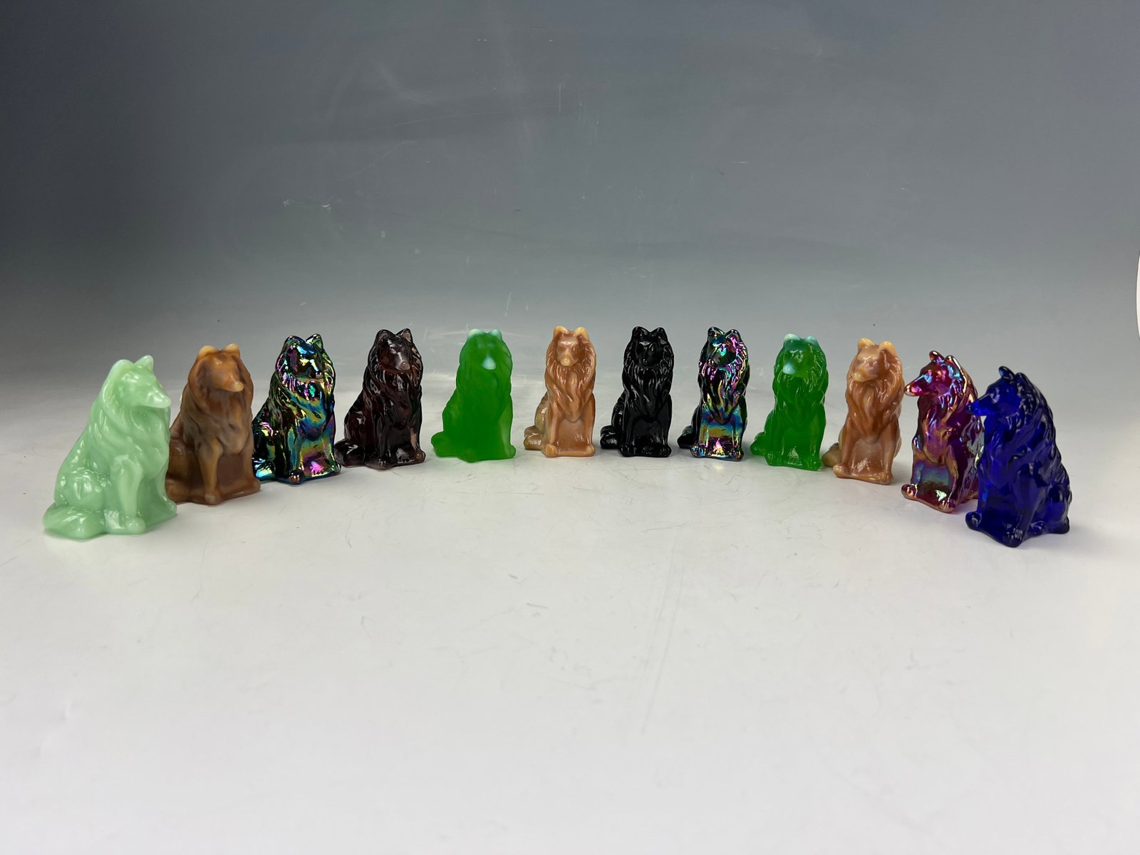 Group of 12 Mosser Glass Border Collie Dog Figurine: The group of twelve Mosser Glass Border Collie Dog Figurine,H 8 cm(3.2 in.) x 12. Preview from Jun 23rd to 27th from 1:00 PM TO 5:00 PM Eastern Time, Location: 15229 Display Court, Rockville MD 20850.