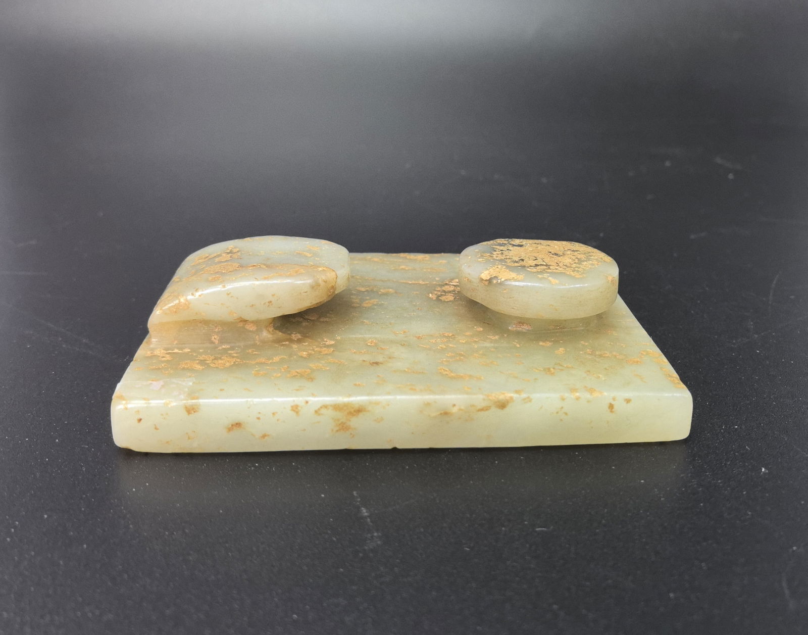 A Chinese Celadon Jade Belt Hook: A Chinese Celadon Jade Belt Hook,Size 7 x 5.4 x 1.7 cm.Preview from Aug. 25th to 29th from 1:00 PM TO 5:00 PM Eastern Time, Location: 15229 Display Court, Rockville MD 20850.