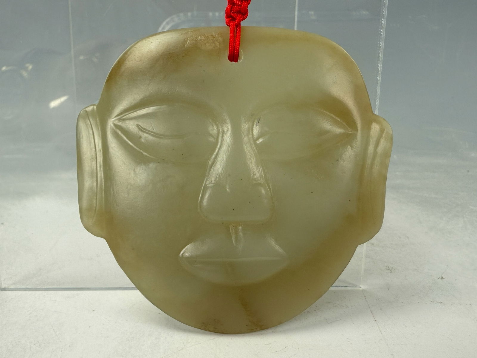 Chinese Hetian Celadon Jade Carved Mask: Hetian celadon jade carved mask. size 7.4 x7.3 cm, Preview from Aug. 25th to 29th from 1:00 PM TO 5:00 PM Eastern Time, Location: 15229 Display Court, Rockville MD 20850.