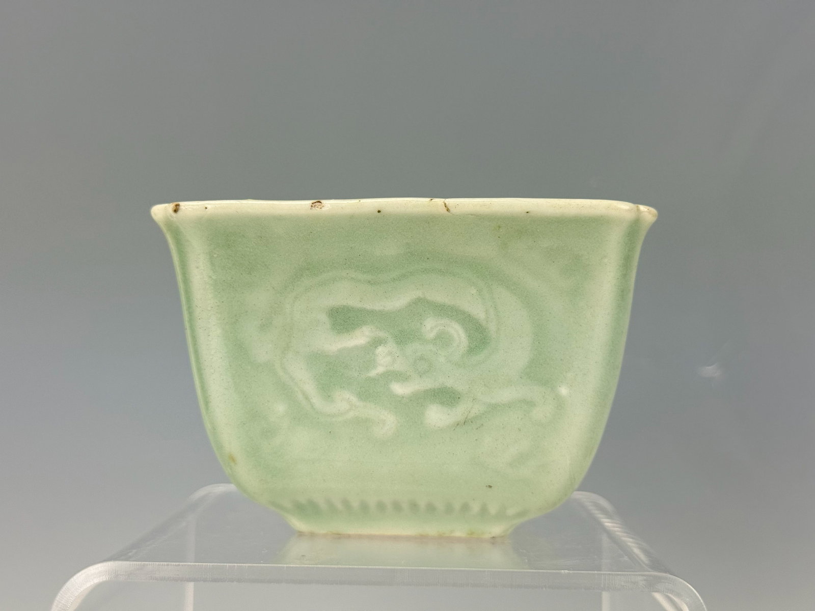 A Longquan Green Celadon Porcelain Square Bowl: A Longquan Green Celadon Porcelain Square Bowl,H 6.5 cm(2.5 in.) x D 9 cm(3.5 in.),Preview from Oct .21st to 24th from 1:00 PM TO 5:00 PM Eastern Time, Location: 15229 Display Court, Rockville MD 2085