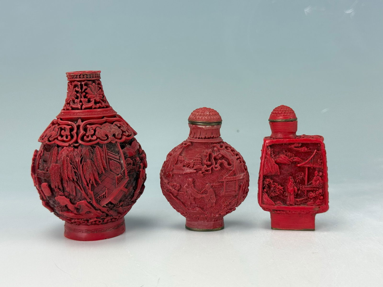 Three Chinese Red Cinnabar Carved Snuff Bottles (1 of 6)
