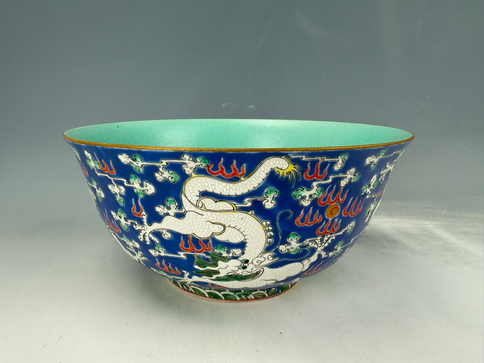 A Large Famille Rose Porcelain Bowl Jiaqing Mark: A Large Famille Rose Porcelain Bowl Jiaqing Mark,painted with dragon and Clouds,D 26 cm(10.3 in.)x H 12 cm(4.8 in.). Preview from Oct .21st to 24th from 1:00 PM TO 5:00 PM Eastern Time, Location: 1522