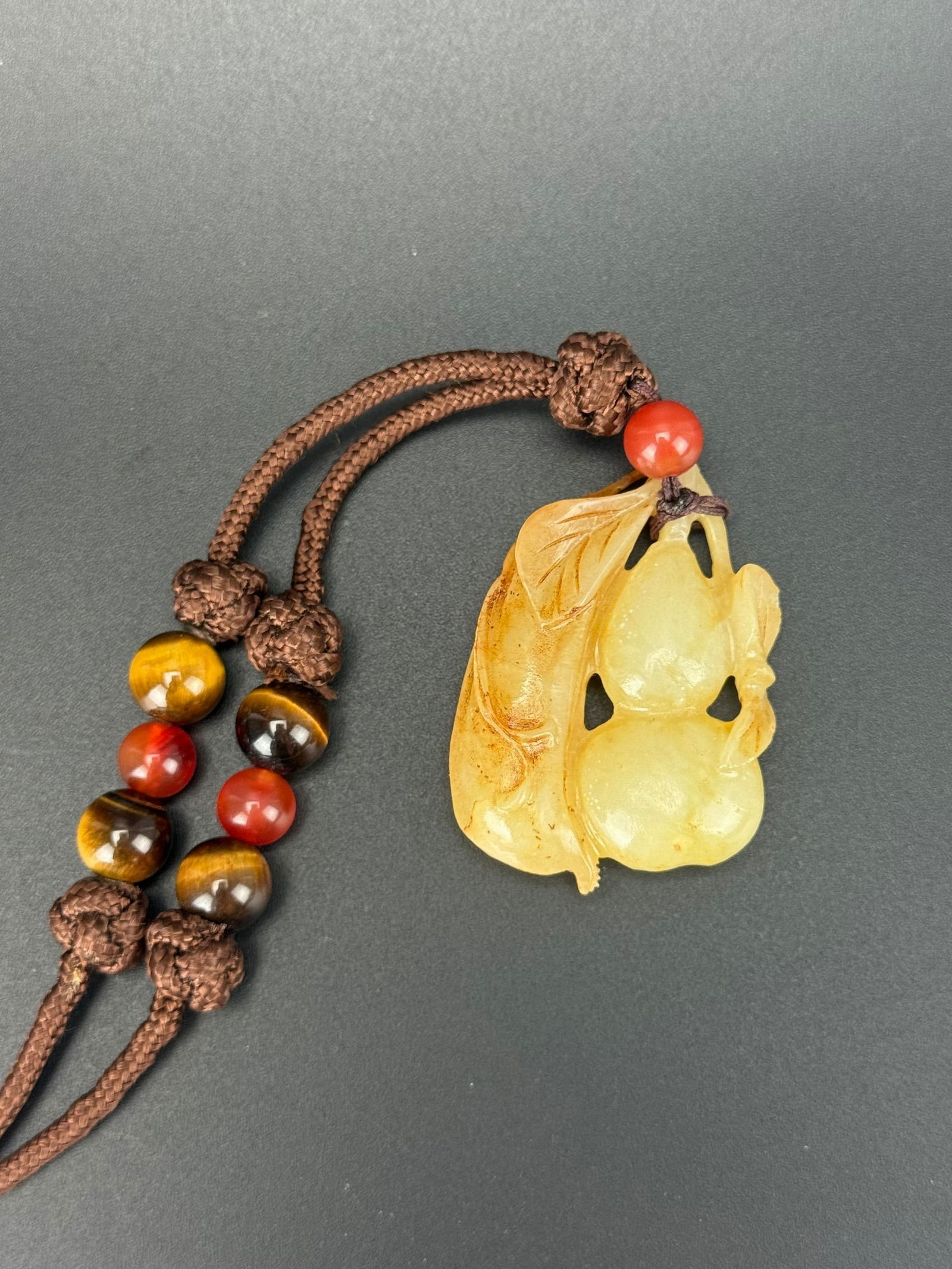 A Chinese Carved Gourd Jade Pendant: A Chinese Carved Gourd Jade Pendant, Size 5 x 4 cm. . Preview from Oct .21st to 24th from 1:00 PM TO 5:00 PM Eastern Time, Location: 15229 Display Court, Rockville MD 20850.