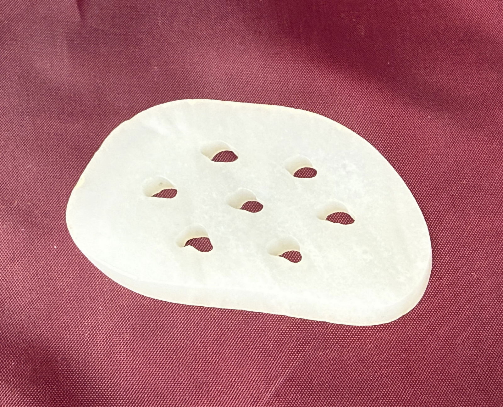 A Chinese Hetian Jade Lotus Root Pendant: A Chinese Hetian Jade Lotus Root Pendant,size 7 x 4 cm.Preview from Feb 23rd to 27th from 1:00 PM TO 5:00 PM Eastern Time, Location: 15229 Display Court, Rockville, MD 20850.